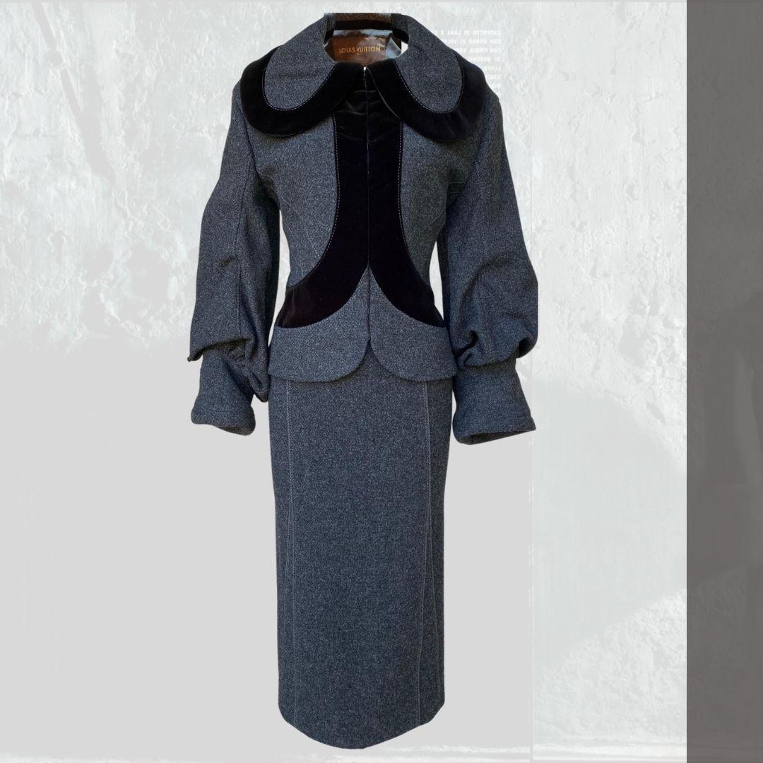 Louis Vuitton - Runway collection skirt suit Fall/Winter 2005.  This dark gray wool suit is trimmed with velvet and a powerful statement! .   Simple yet dynamic in structure and elegance.  The suit jacket is lined and fastens with hook and eye