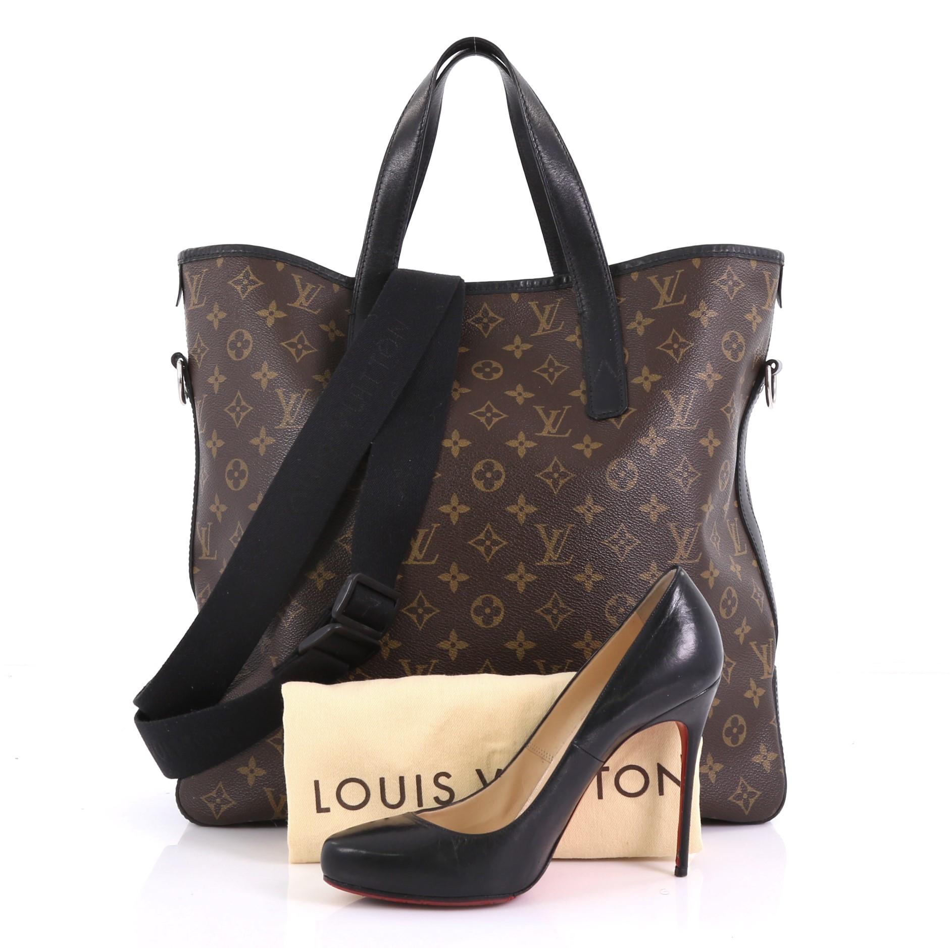 This Louis Vuitton Davis Handbag Macassar Monogram Canvas, crafted in brown monogram coated canvas and black leather, features dual flat leather handles, leather trim, protective base studs, and silver-tone hardware. Its magnetic snap closure opens