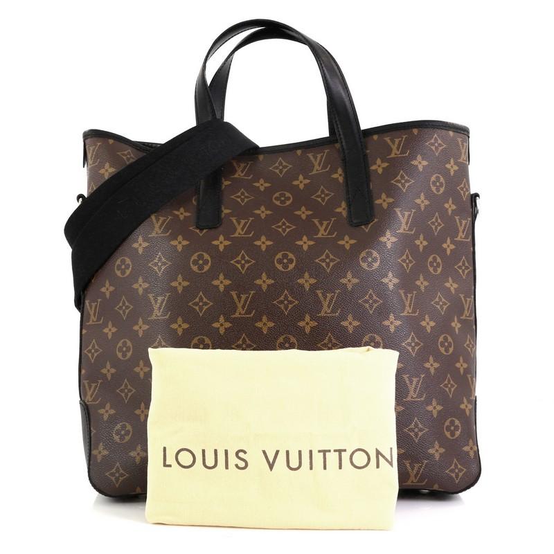 This Louis Vuitton Davis Handbag Macassar Monogram Canvas, crafted from brown monogram coated canvas, features dual flat leather handles, black leather trim and silver-tone hardware. It opens to a purple fabric interior with slip pockets.