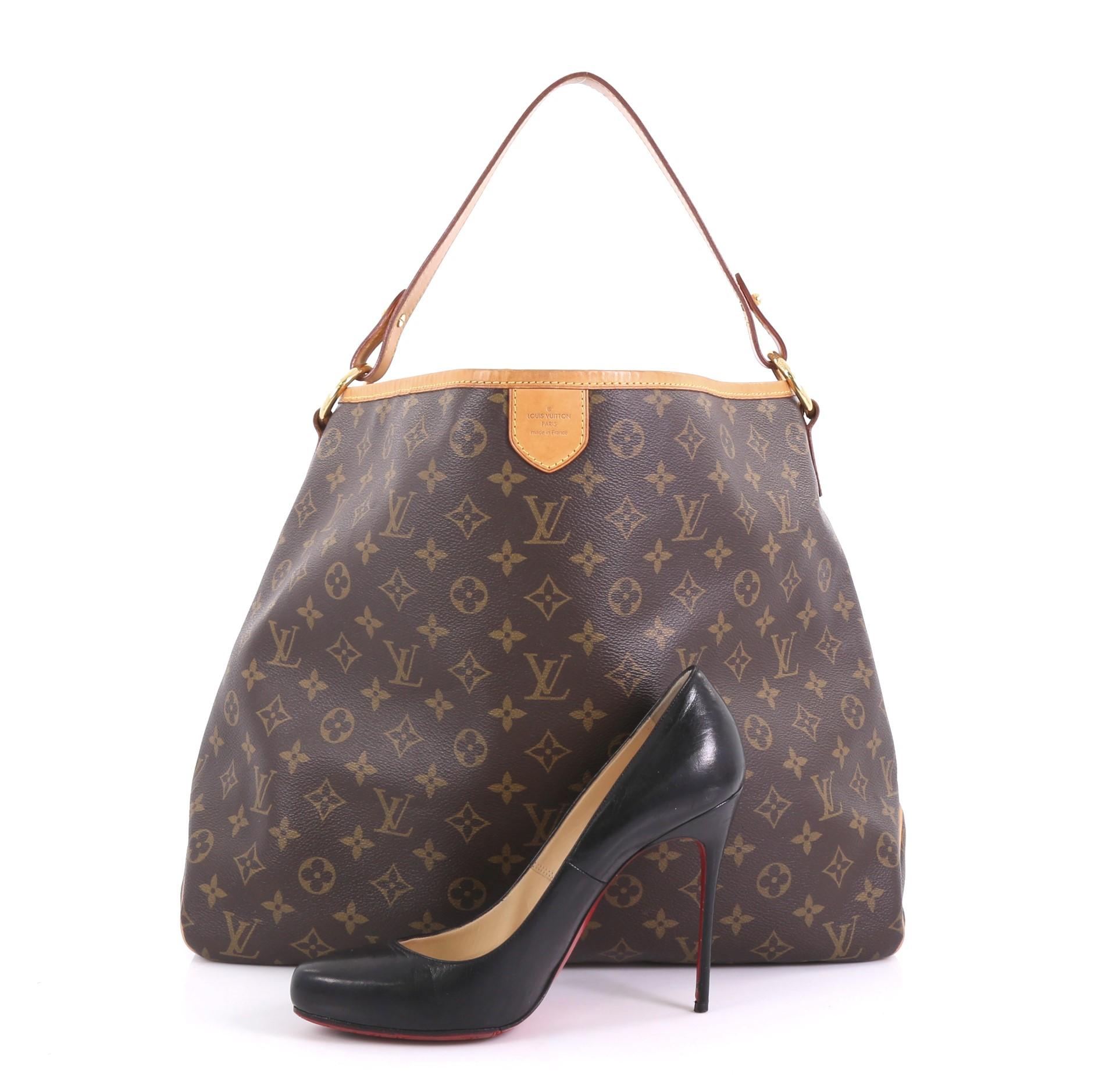 This Louis Vuitton Delightful Handbag Monogram Canvas MM, crafted in brown monogram coated canvas, features a flat leather handle and gold-tone hardware. Its hook closure opens to a beige fabric interior with side zip pocket. Authenticity code