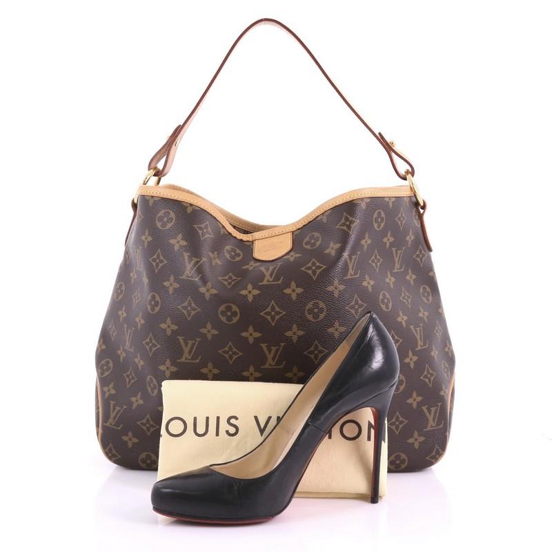 This Louis Vuitton Delightful Handbag Monogram Canvas PM, crafted in brown monogram coated canvas, features a flat leather loop handle, cowhide leather trims, and gold-tone hardware. Its snap hook closure opens to a beige fabric interior with side