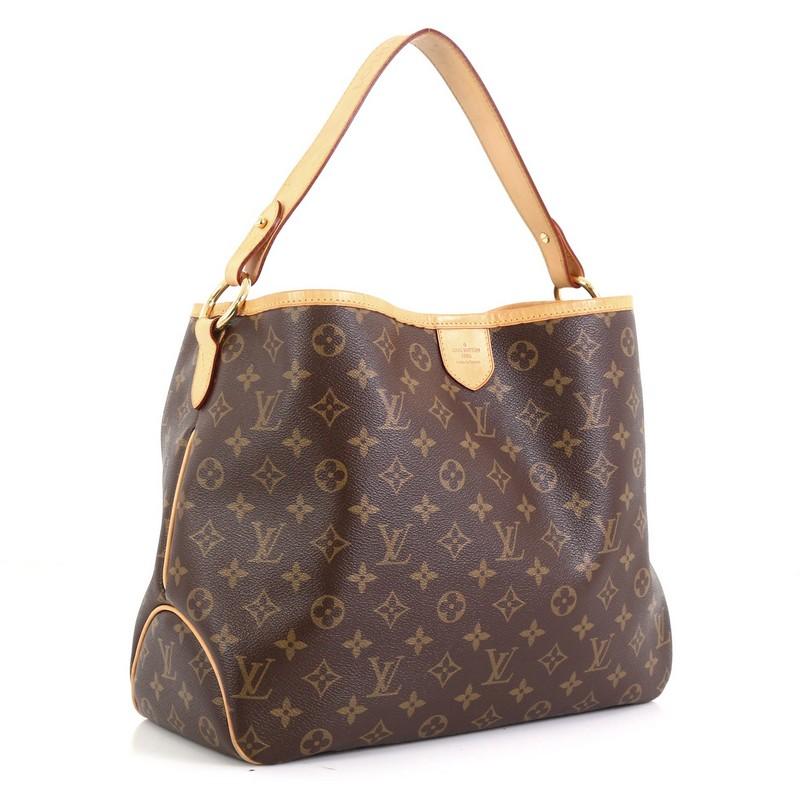 This Louis Vuitton Delightful Handbag Monogram Canvas PM, crafted in brown monogram coated canvas, features a flat leather loop handle, cowhide leather trim, and gold-tone hardware. Its hook closure opens to a neutral fabric interior with side zip
