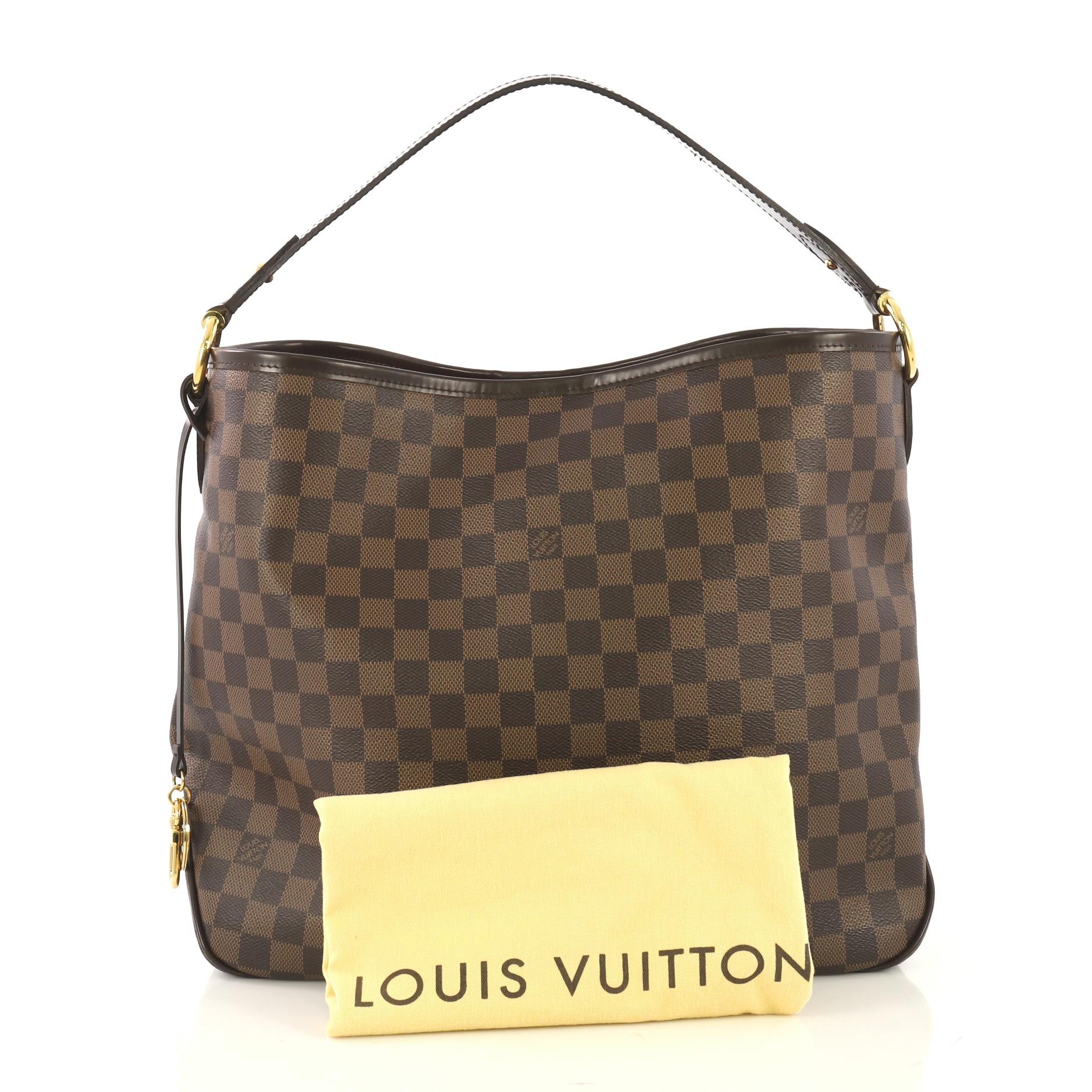 This Louis Vuitton Delightful NM Handbag Damier MM, crafted in damier ebene coated canvas, features a flat leather handle and gold-tone hardware. Its hook closure opens to a red fabric interior with side zip pocket. Authenticity code reads: SD1135.