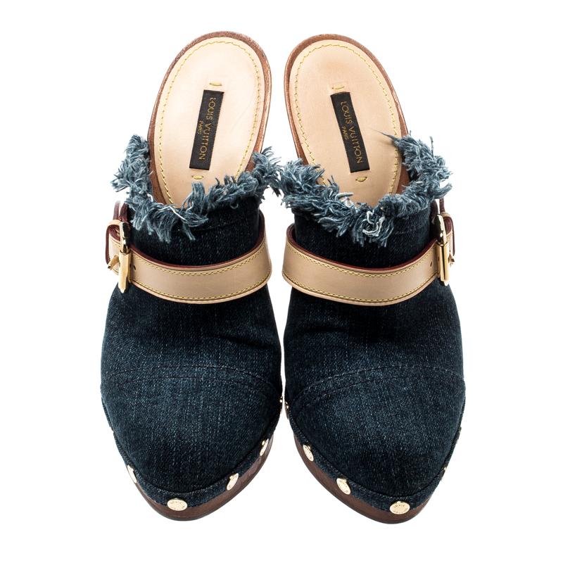 Comfort and style come together and bring forth these fabulous Louis Vuitton mules that deserve a very special place in your wardrobe! The blue clogs are crafted from denim and feature almond toes, buckled leather straps on the vamps, studded