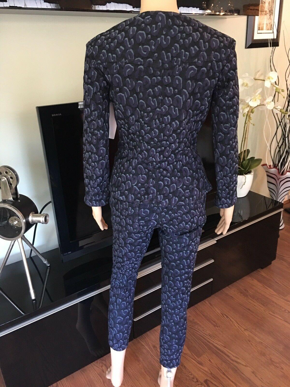 Louis Vuitton Denim Pants Jeans and Jacket Coat 2 Piece Set Pantsuit FR 38

Louis Vuitton dark wash blue leopard pattern denim pantsuit. Jacket features three pockets at front and exposed asymmetrical zip closure at front. Mid-rise skinny