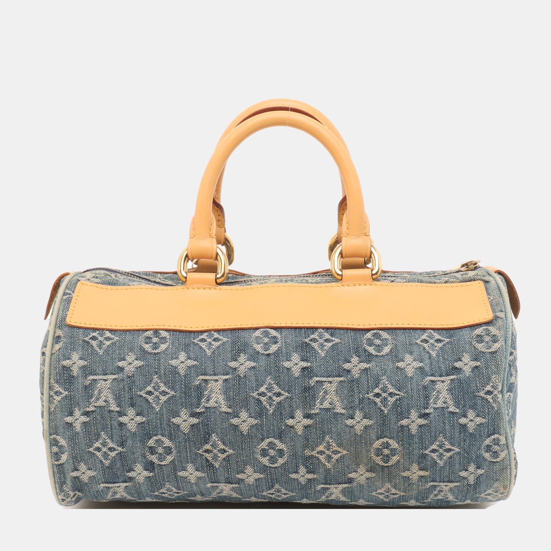 Louis Vuitton Denim Neo Speedy Boston Bag
 These are professional photos of the actual bag.
 Light wash blue monogram denim Louis Vuitton Neo Speedy with brass hardware, tan vachetta leather trim, dual rolled top handles, three exterior pockets; one