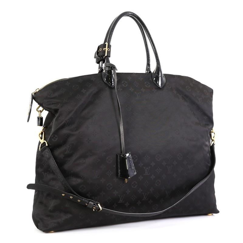 This Louis Vuitton Desire Lockit Bag Monogram Nylon GM, crafted from black nylon, features dual rolled leather handles and gold-tone hardware accents. Its zip closure opens to a black nylon interior with zip pocket. Authenticity code reads: FO2181.