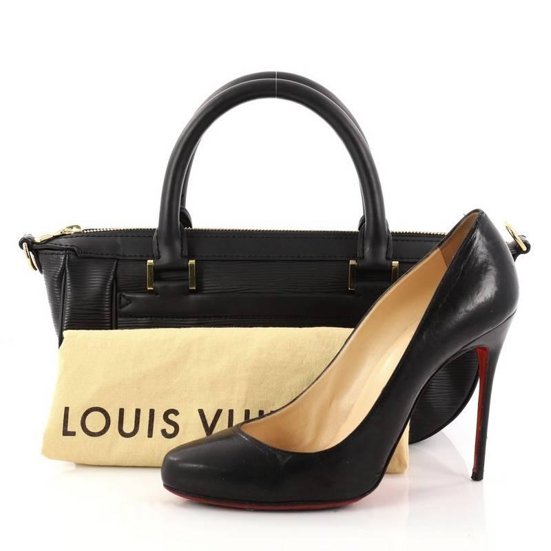 This authentic Louis Vuitton Dhanura Handbag Epi Leather PM is the perfect bag for daily or evening outfits. Constructed of sturdy black epi leather, this bag features a unique boat-like silhouette, dual-rolled leather handles, and gold-tone