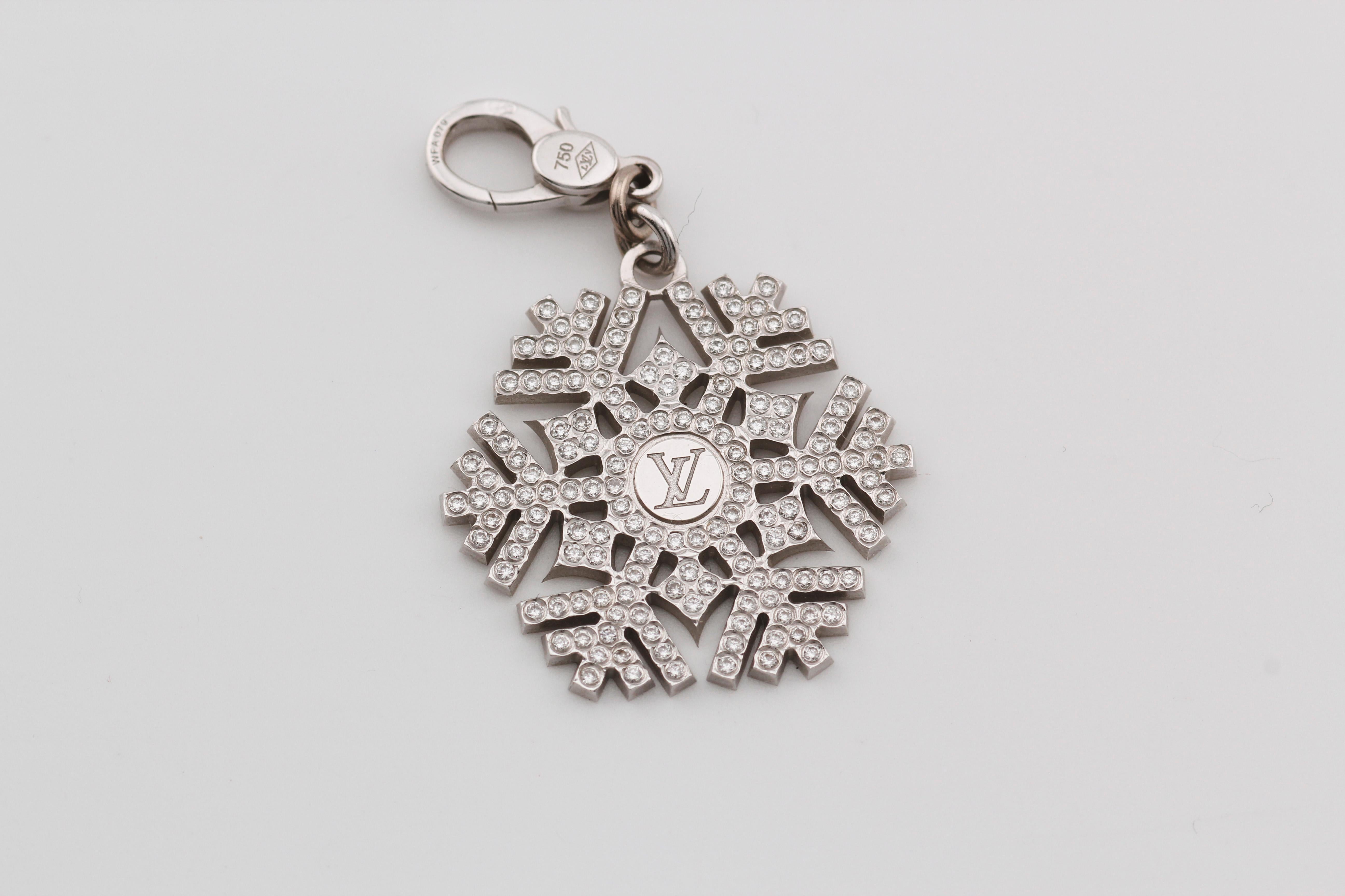 Introducing the Louis Vuitton Diamond 18K White Gold Snowflake Charm Pendant, an exquisite embodiment of luxury and sophistication. Crafted with precision and elegance, this pendant captures the timeless allure of winter's delicate