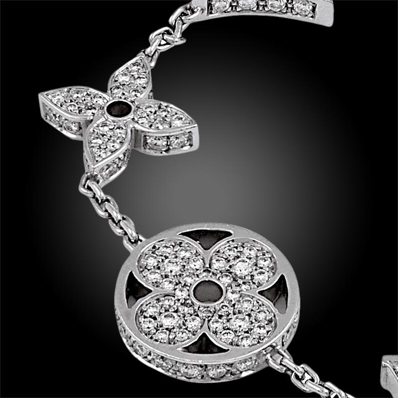 Louis Vuitton's iconic LV initials meet their iconic monogram flowers, together comprising a sleek and sophisticated seven charmed bracelet crafted in brilliant cut diamonds mounted in 18k white gold, measuring approximately 6.5″ long.
Signed Louis