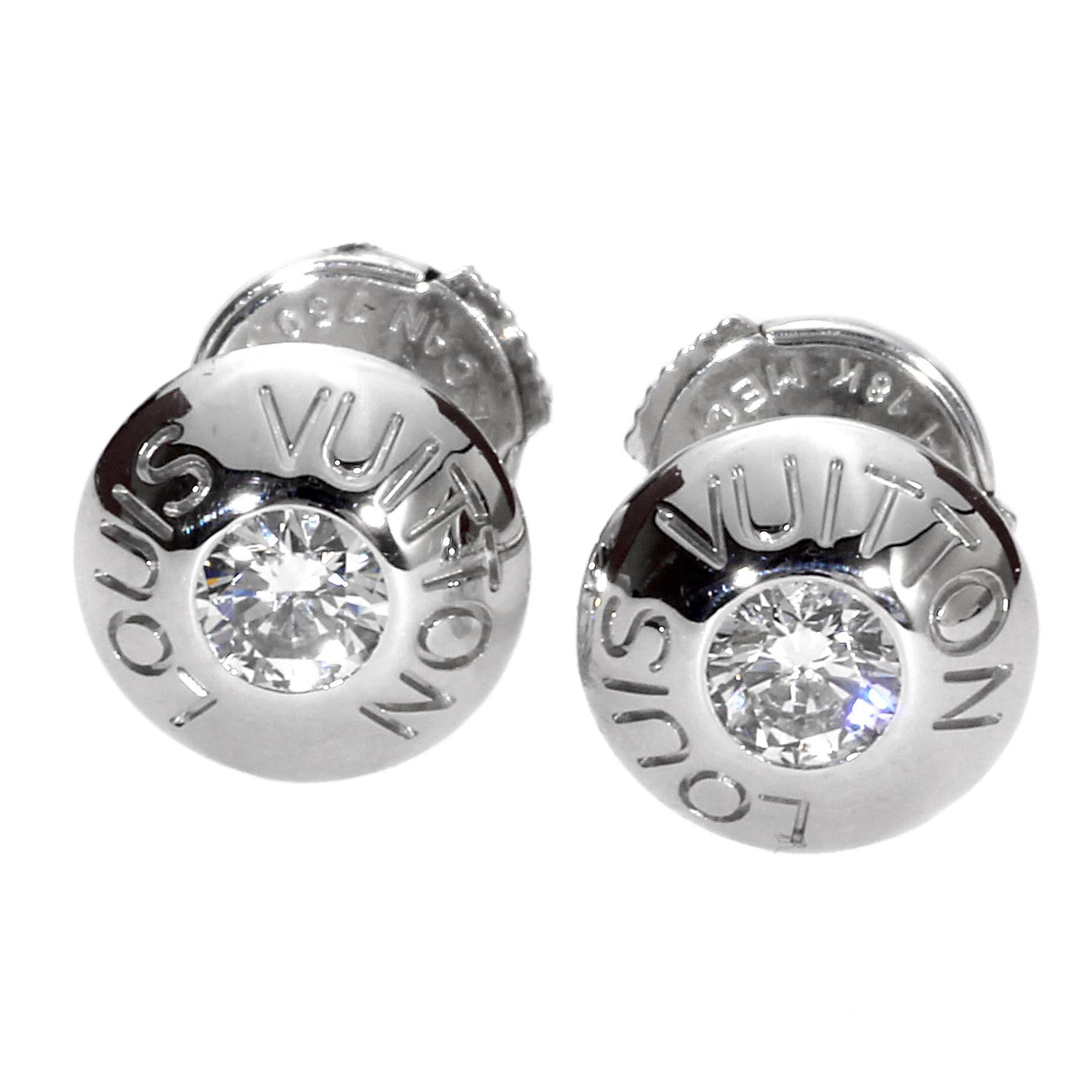 A very chic pair of authentic Louis Vuitton earrings exquisitely crafted in diamonds and white gold. These lovely Louis Vuitton earrings are a real treasure! They have a total of .30 carats of diamonds and are engraved with the Louis Vuitton logo in