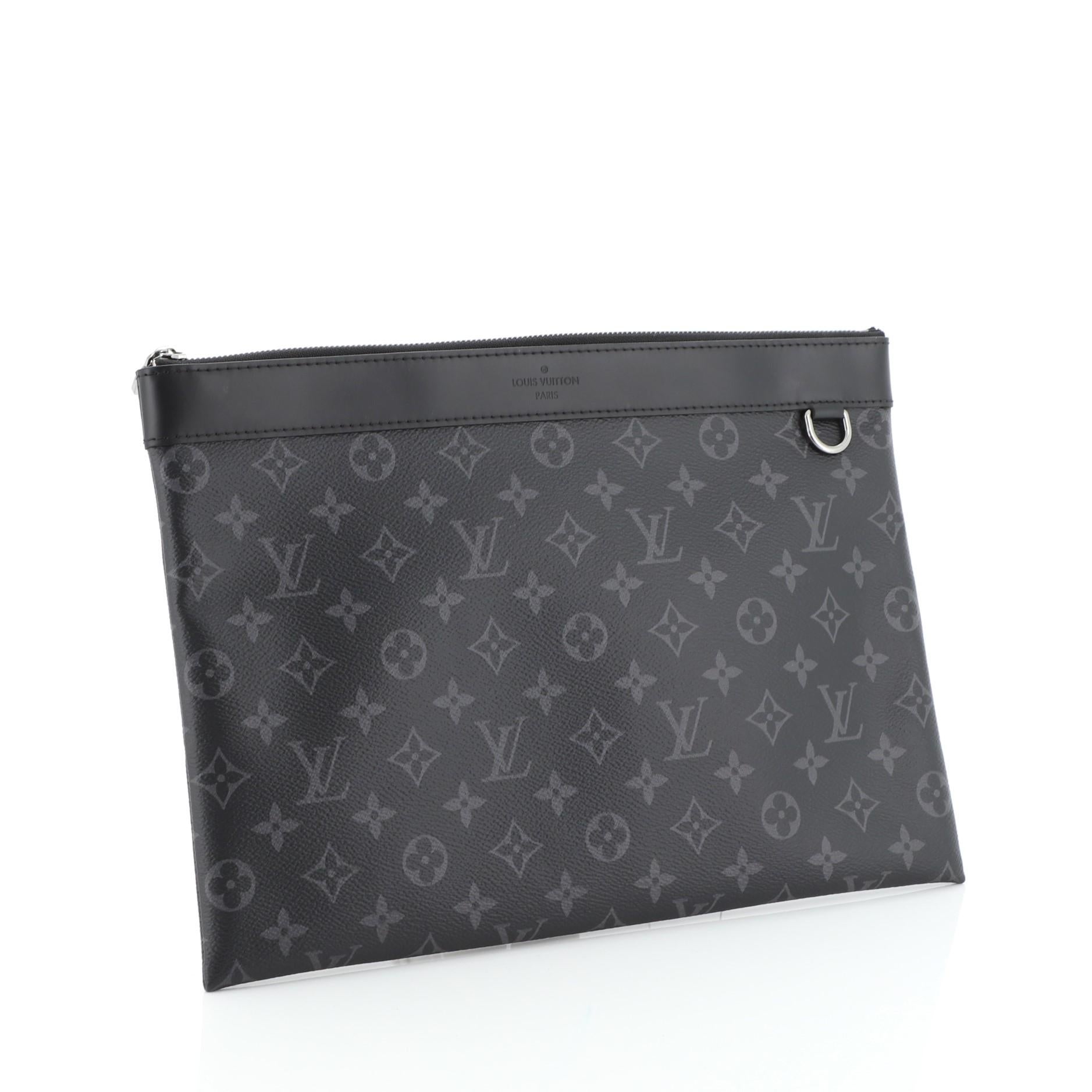 This Louis Vuitton Discovery Pochette Monogram Eclipse Canvas GM, crafted from black monogram eclipse coated canvas, features gunmetal-tone hardware. Its zip closure opens to a black fabric interior with slip pocket. Authenticity code reads: TN3198.