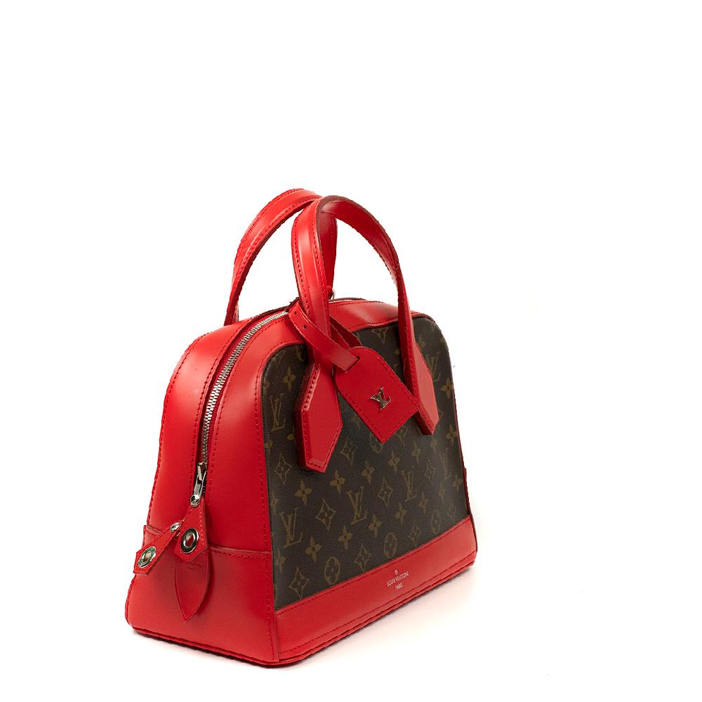 - Designer: LOUIS VUITTON
- Model: Dora
- Condition: Very good condition. Minor sign of wear on base corners, Sign of wear on handles
- Accessories: Original Dustbag
- Measurements: 
- Exterior Material: Canvas
- Exterior Color: Red
- Interior