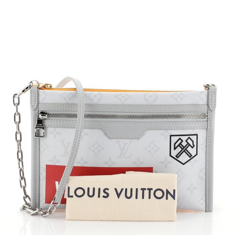 This Louis Vuitton Double Flat Messenger Bag Limited Edition, crafted in Monogram White Canvas, orange printed denim and coated canvas, features chain-link and leather strap, carabiner-inspired hook at the side and grass silver-tone hardware. Its