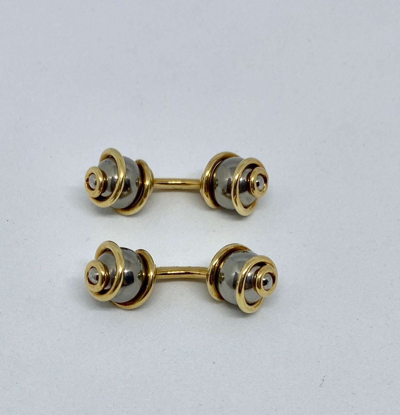 Fine and rare, these double-sided cufflinks were made in France from solid 18K yellow gold and retailed by Louis Vuitton.

Both cufflinks bear the 
