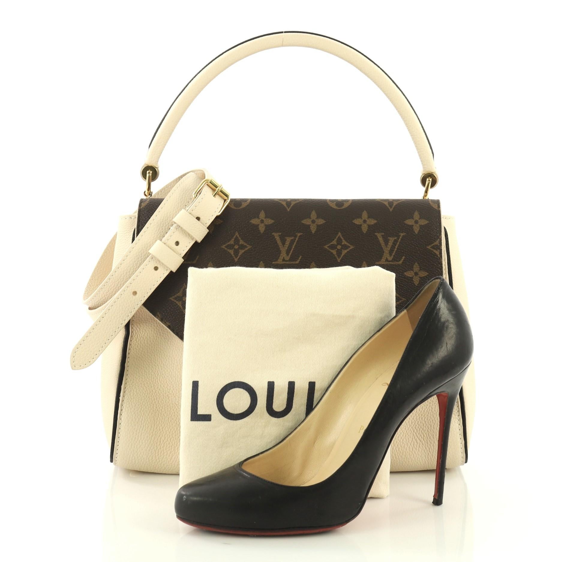 This Louis Vuitton Double V Handbag Calfskin and Monogram Canvas, crafted in cream calfskin and brown monogram coated canvas, features a rolled top handle, exterior back pocket, two V flaps, and gold-tone hardware. Its magnetic snap button closure