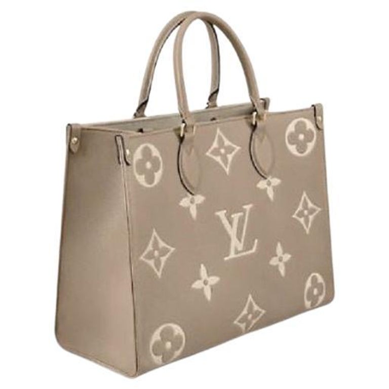Louis Vuitton Dove Grey/Cream Embossed grained cowhide leather OnTheGo MM  Bag For Sale at 1stDibs