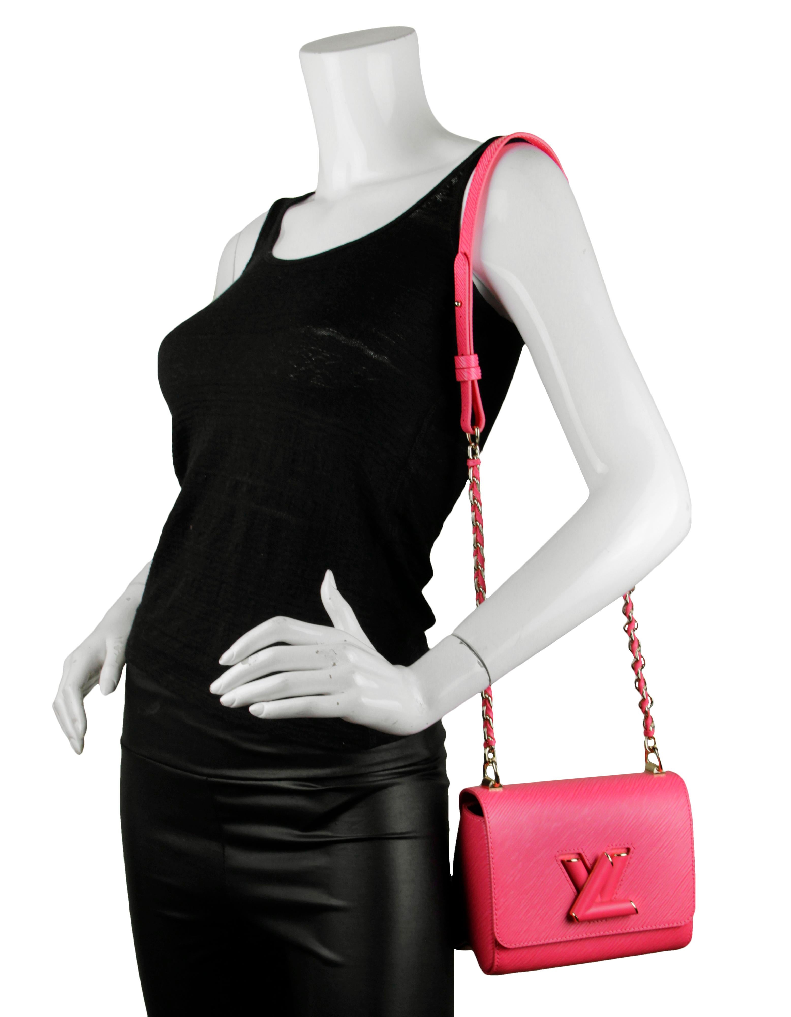 Louis Vuitton Dragon Fruit Epi Leather Twist PM CrossbodyBag

Made In: France
Color: Dragon fruit pink
Hardware: Tone-on-tone and gold-color hardware
Materials: Epi leather with cowhide leather trim
Lining: Microfiber
Closure/Opening: LV