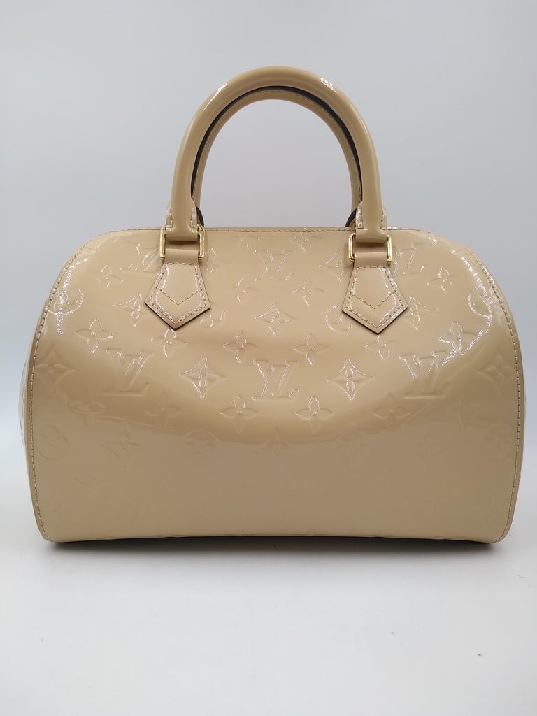 Louis Vuitton Dune Monogram Vernis Montana Bag, 2014.
-100% authentic Louis Vuitton
- Dune coated Monogram embossed varnish calf leather
- One flat pocket inside
- Double rolled patent leather top handles
- Two-way zip closure
- Fine textile