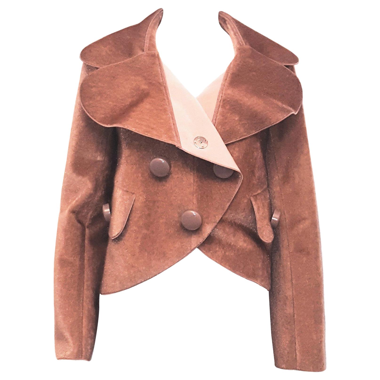 Louis Vuitton dusty rose double breasted wide rounded notch collar faux fur jacket resembles pony leather.  For closure, 5 hidden snaps and 5 visible large Louis Vuitton round buttons are featured.  Two wide flap pockets at front with a single