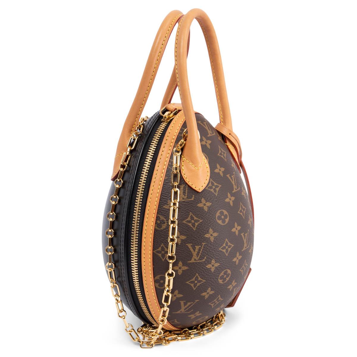 100% authentic Louis Vuitton Egg shoulder bag in Ebene brown Mongoram canvas with natural Vachetta leather trims. Detachable chain crossbody/shoulder strap. Closes with a two-way zipper on top. Lined in black leather. Has been carried and is in