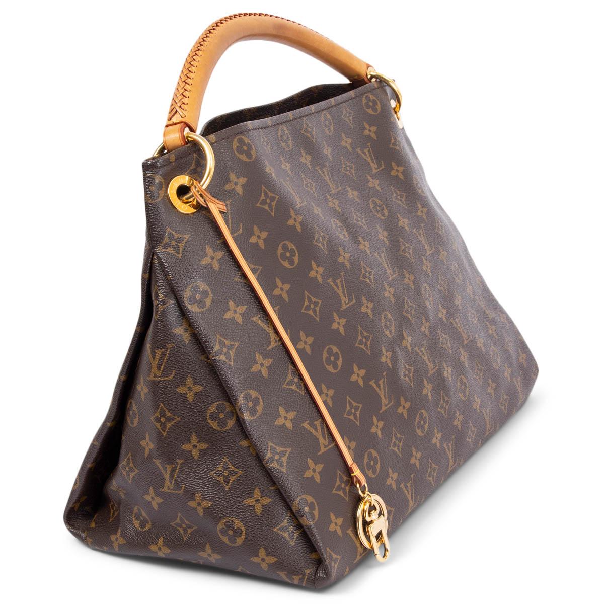 100% authentic Louis Vuitton Artsy MM shoulder bag in brown monogram canvas and tan leather. Lined in beige alcanthara with three open pockets against the front and three open and one zipper pockets against the back. Comes with leather strap with