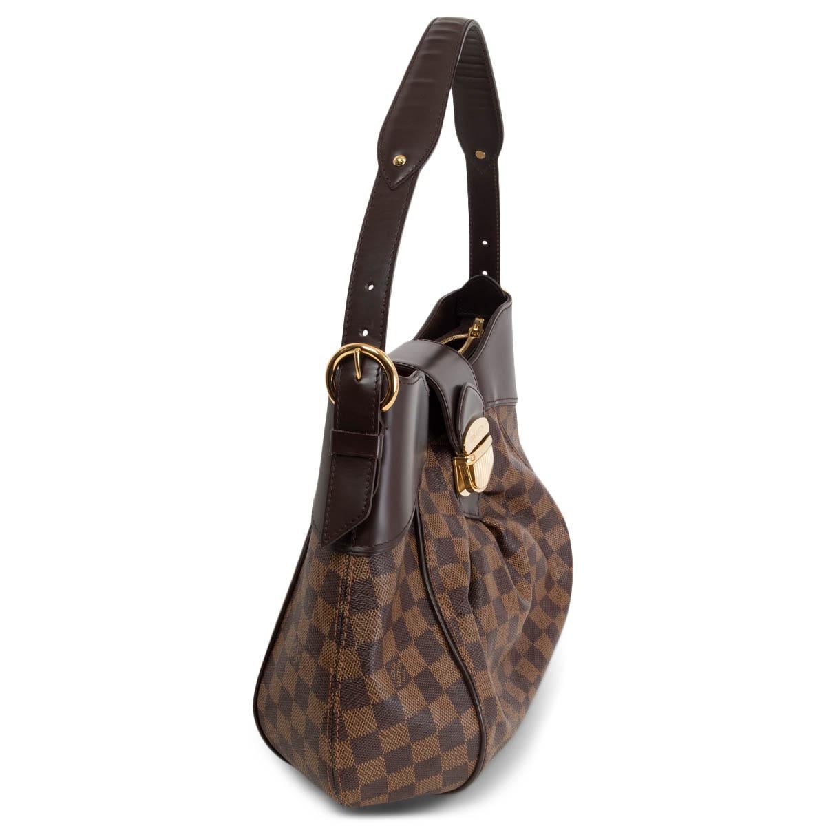 100% authentic Louis Vuitton Sistina MM Hobo Bag in brown and camel Ebene Damier canvas with brown calfskin trimming. Opens with a zipper on top and is lined in red microfibre with two open pockets against the back. The pleated shape with a fold