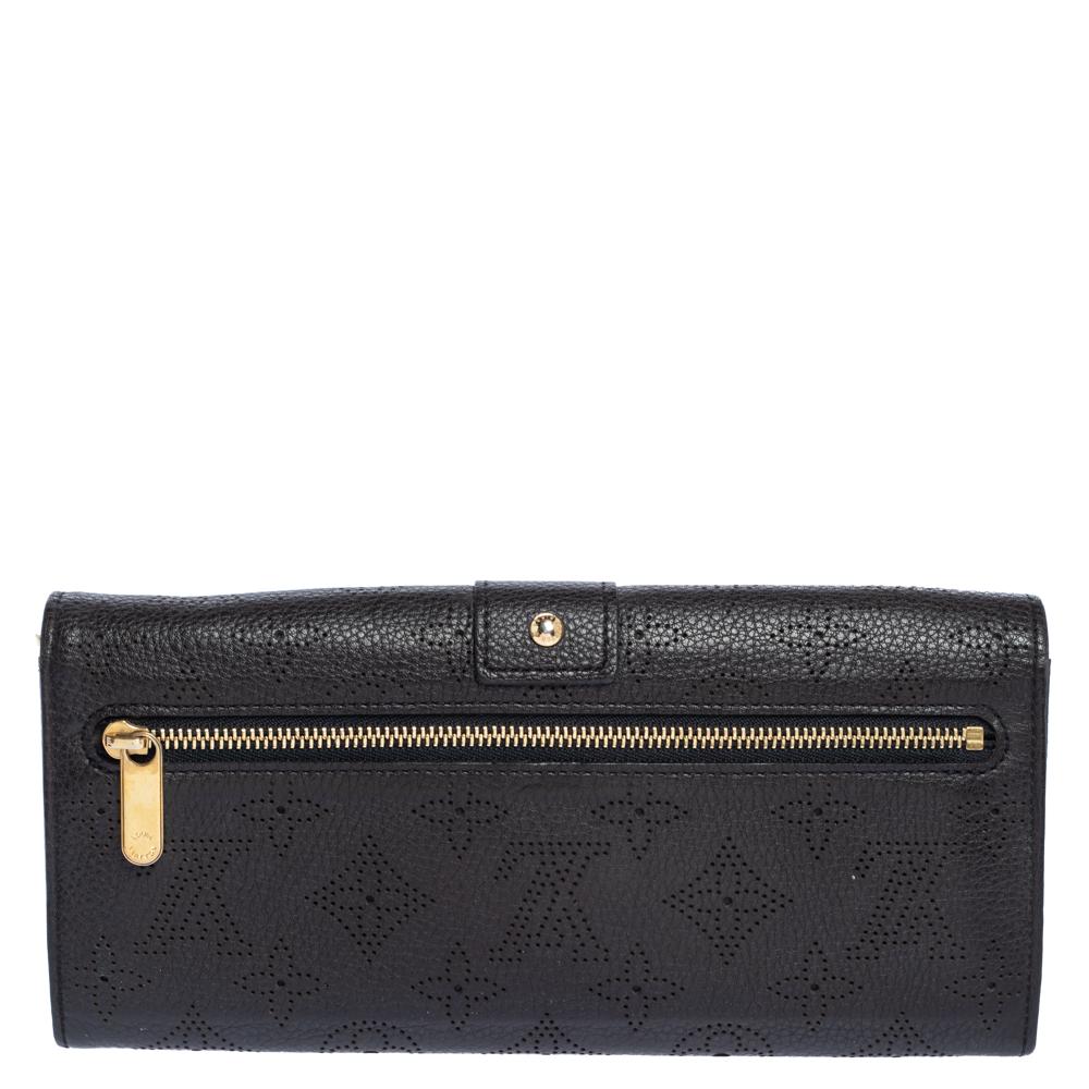 Made from premium monogram Mahina leather, this wallet is a long-lasting accessory. Store your daily essentials and put together a stylish look with this wallet from Louis Vuitton. Featuring a rich brown shade, this superb wallet will last you many