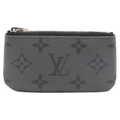 Porte-monnaie The Eclipse Pochette de Louis Vuitton