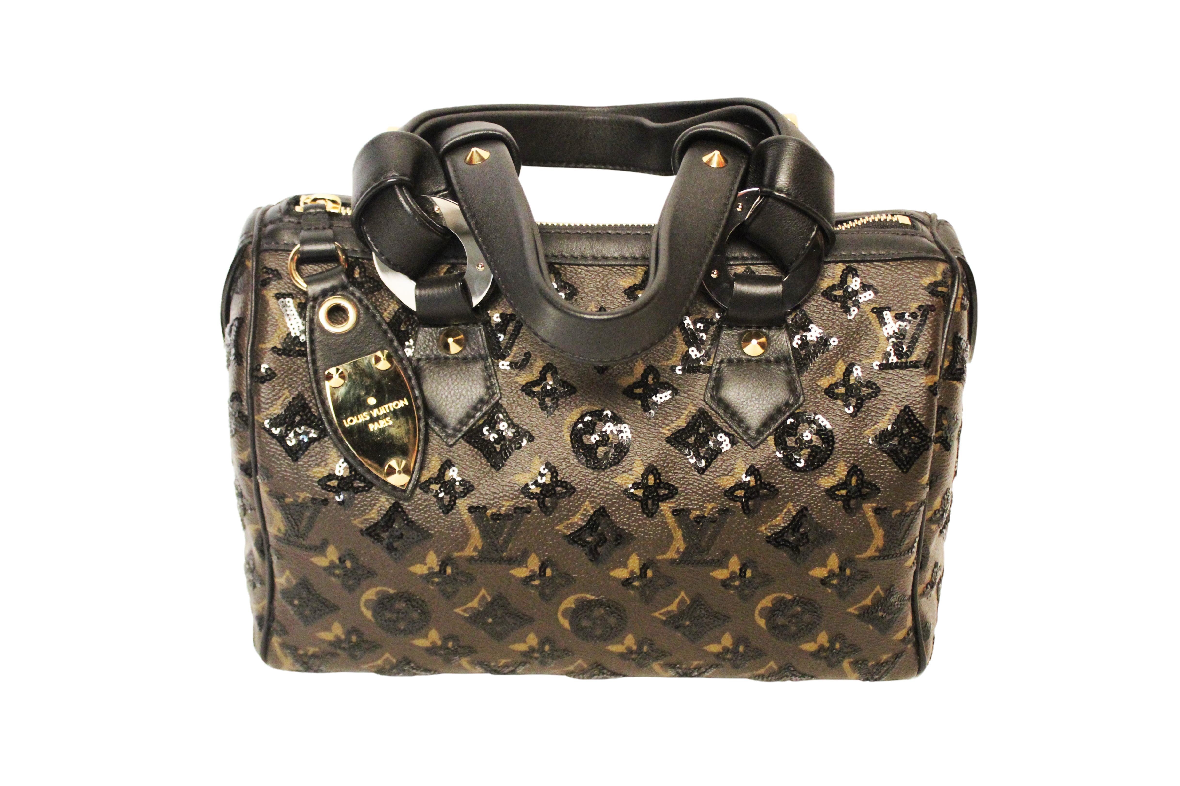 Louis Vuitton limited edition sequinned monogram Eclipse Speedy 28 from F/W09.

The classic monogram speedy features black sequin embroidery,  incredibly soft calfskin leather top handles tied in knots on large silver toned rings, silver and brass