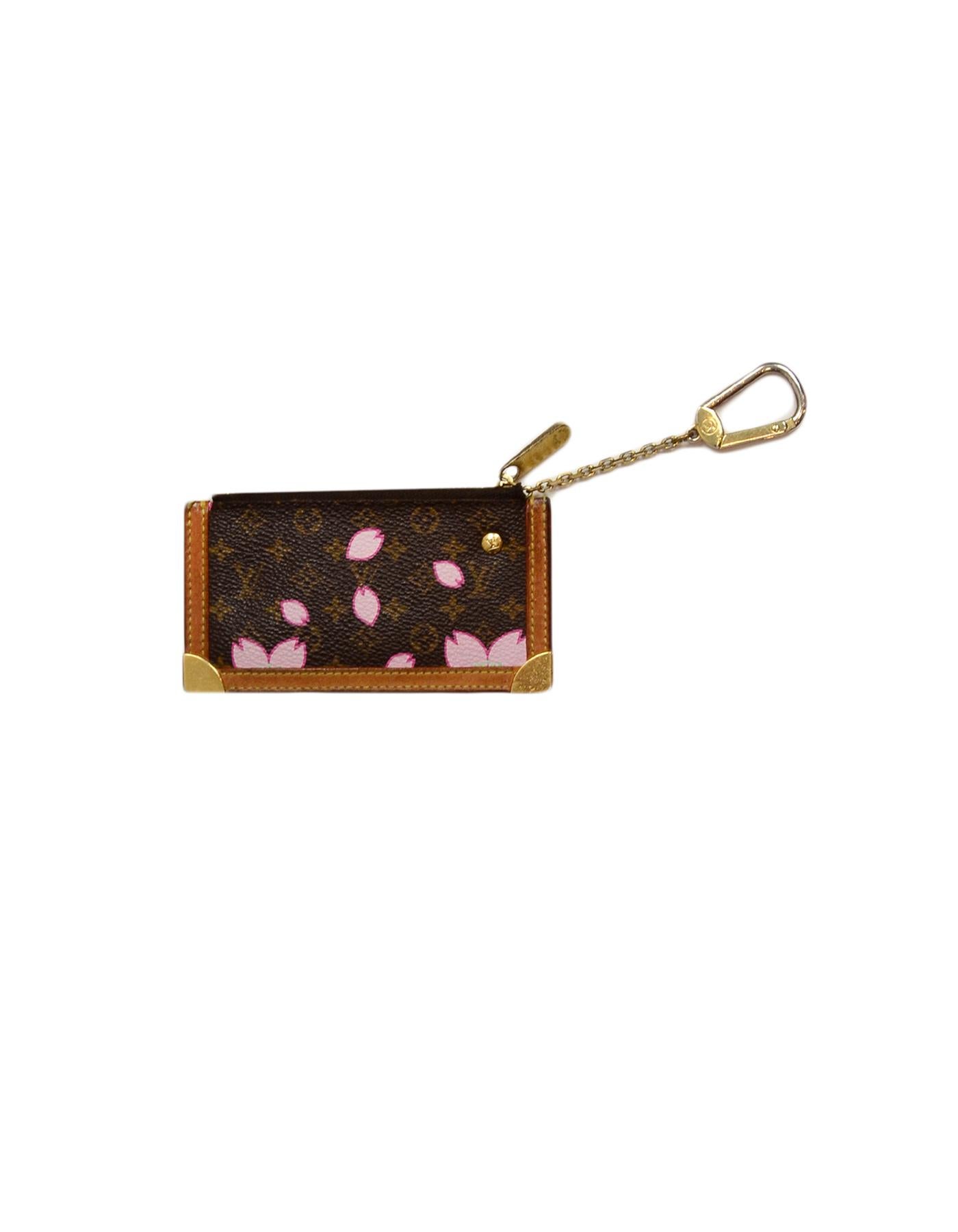 Louis Vuitton Edition Monogram Cherry Blossom Key Pouch/Coin Purse

Made In: Spain
Year of Production: 2003
Color: Brown
Hardware: Goldtone
Materials: Monogram
Lining: Leather
Closure/Opening: Top zip
Exterior Pockets: None
Interior Pockets: