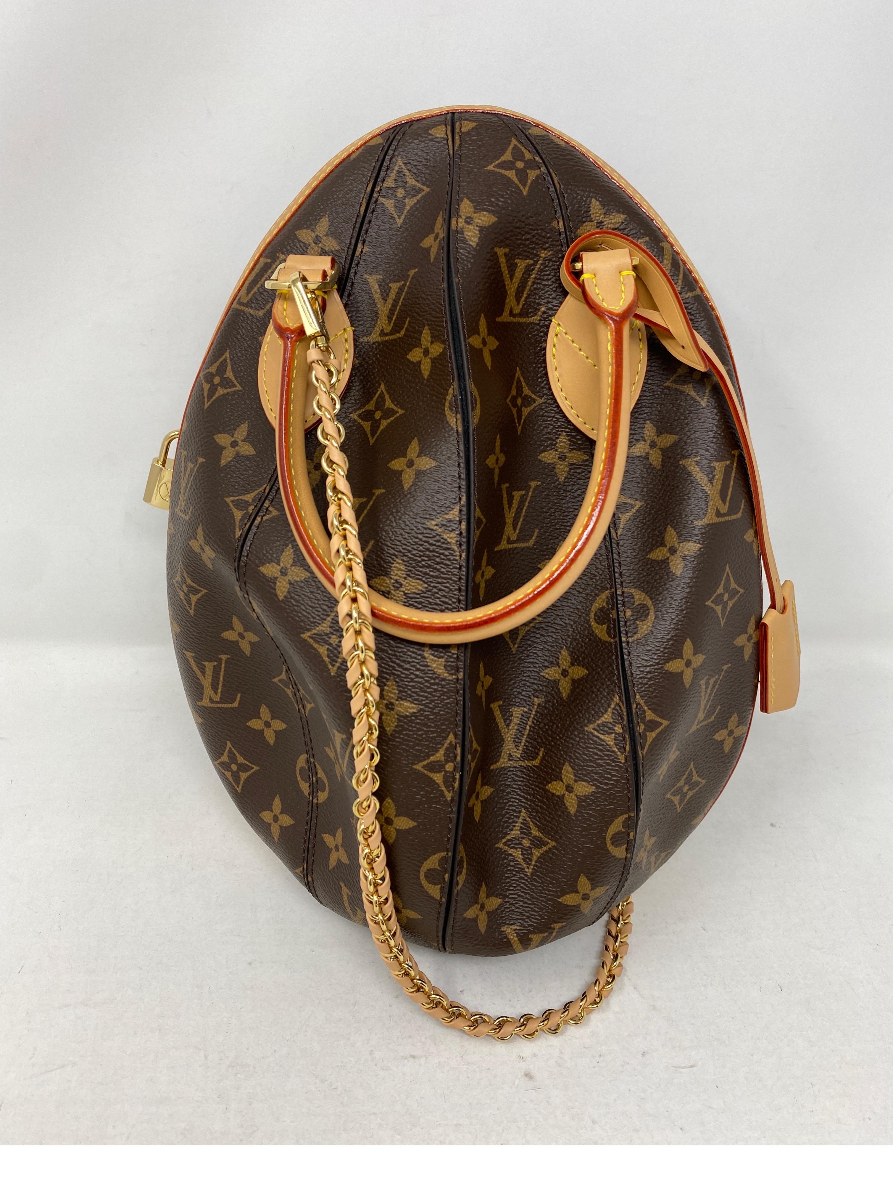 Louis Vuitton Egg Bag. Limited and rare egg shaped bag by LV. Monogram canvas and black leather. Excellent condition like new. Rare and collector's piece. Includes tag and dust cover. Guaranteed authentic. 