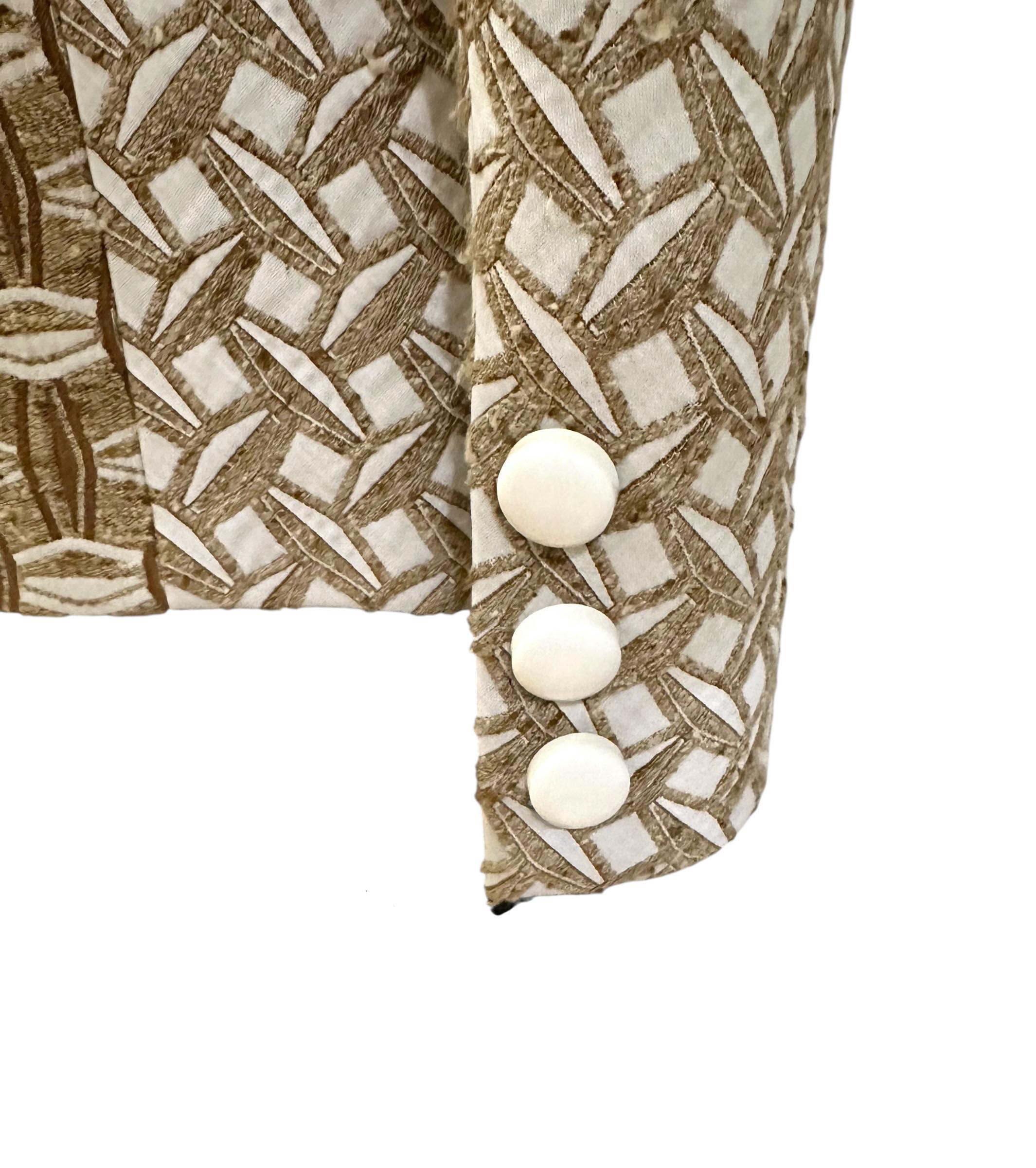 This pre-owned but new Louis Vuitton Jacket probably dates from Marc Jacobs later years.
He utilized rich embellishments, tactile fabrics, and unexpected materials like sequins and fringe tailored pieces made of cotton-silk blends.

Fabric: 50%