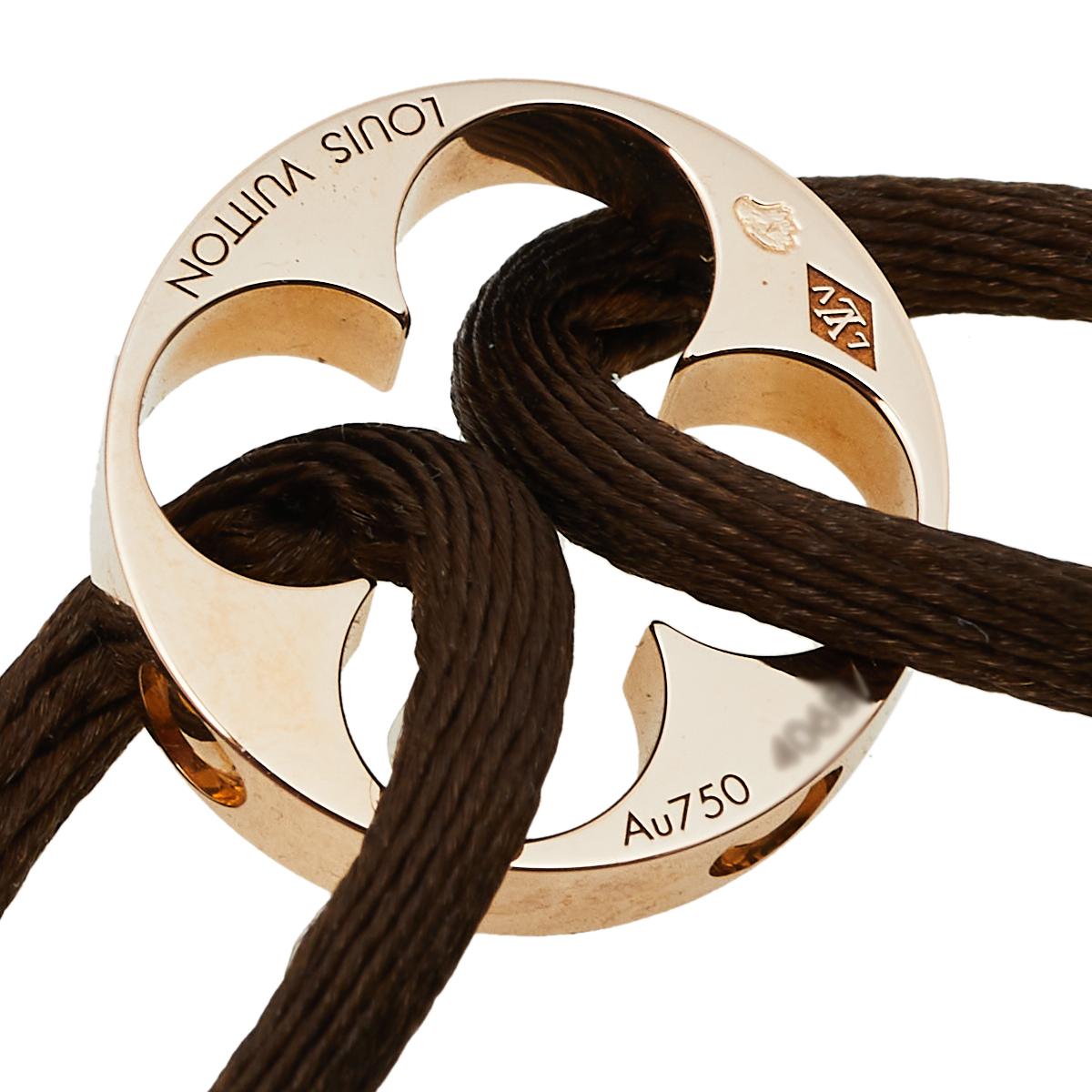 This minimalist bracelet comes from Louis Vuitton that exudes elegance and style. This creation features two loops that carry an 18k gold ring, a signature of the collection. It can be styled every day with your watch or just by itself.

Includes: