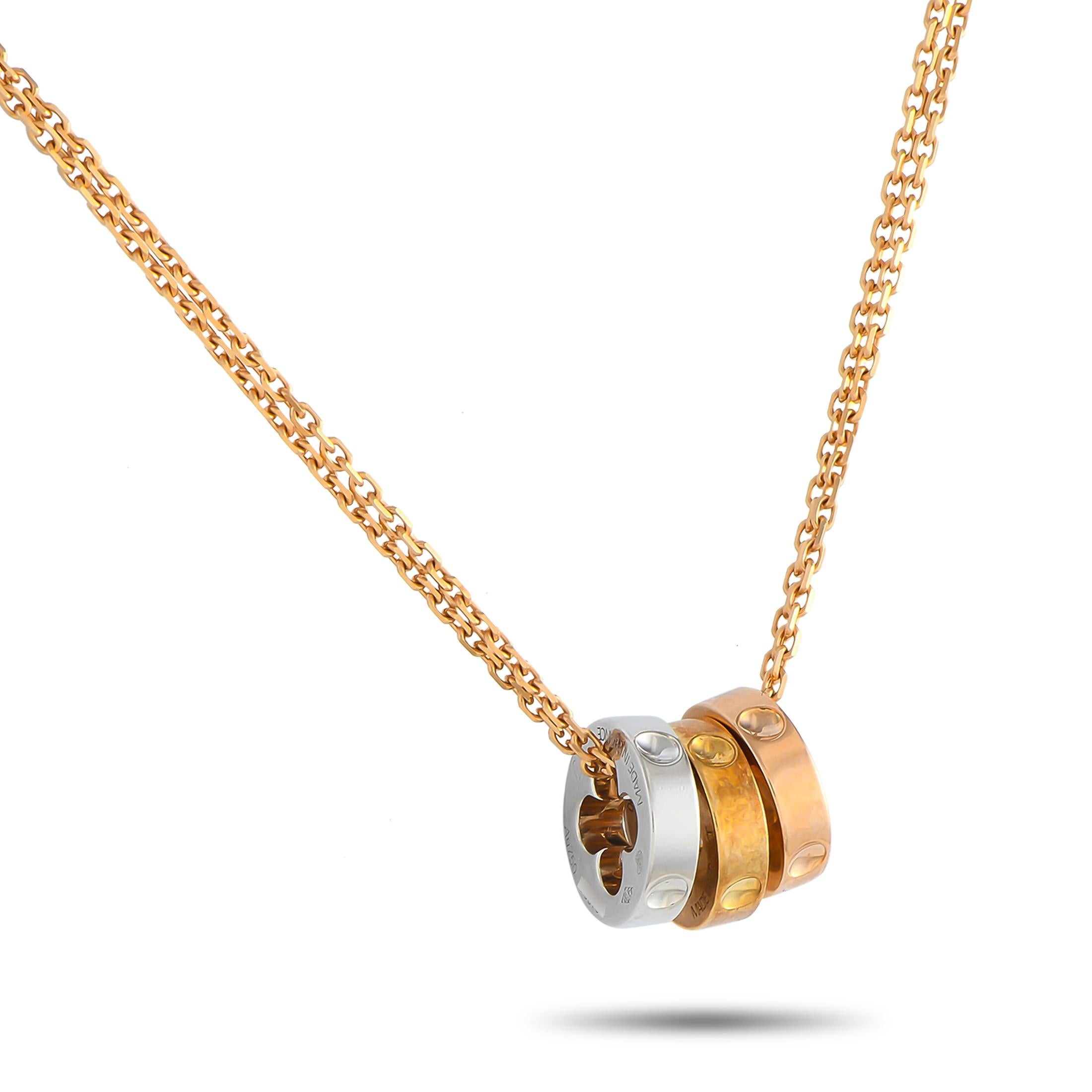 Round out your jewelry collection with this necklace from Louis Vuitton's Empreinte collection. It features a rose gold chain with a lobster clasp and a trio of rings as pendants. The three rings are detailed with imprints inspired by the nails used