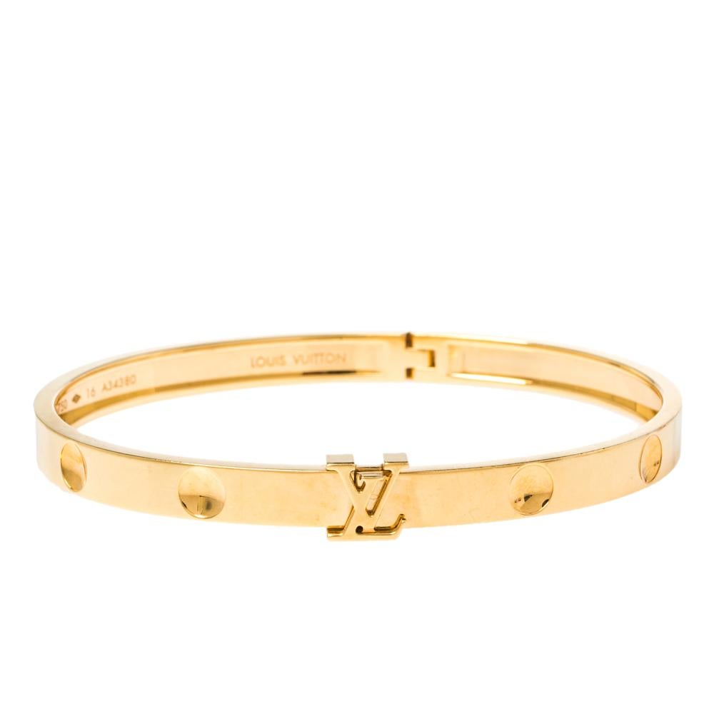 Add a touch of unparalleled luxury to your look by wearing this beautiful bangle by Louis Vuitton. Inspired by the imprint of Louis Vuitton trunk nails, this Empreinte collection is perfect for the lovers of minimalism. Rendered in 18k yellow gold,