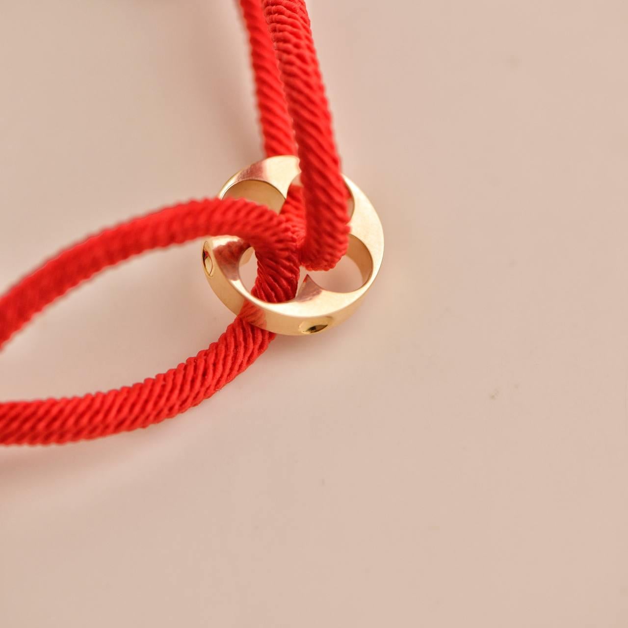 Louis Vuitton Empreinte 18K Yellow Gold Red Cord Bracelet In Excellent Condition For Sale In Banbury, GB
