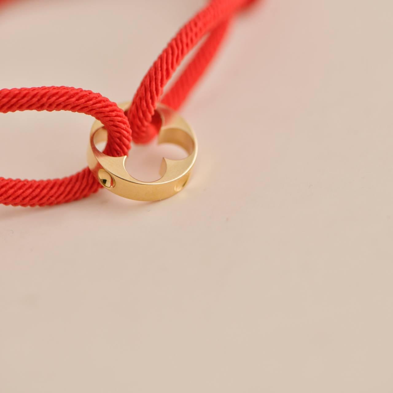 Women's or Men's Louis Vuitton Empreinte 18K Yellow Gold Red Cord Bracelet For Sale