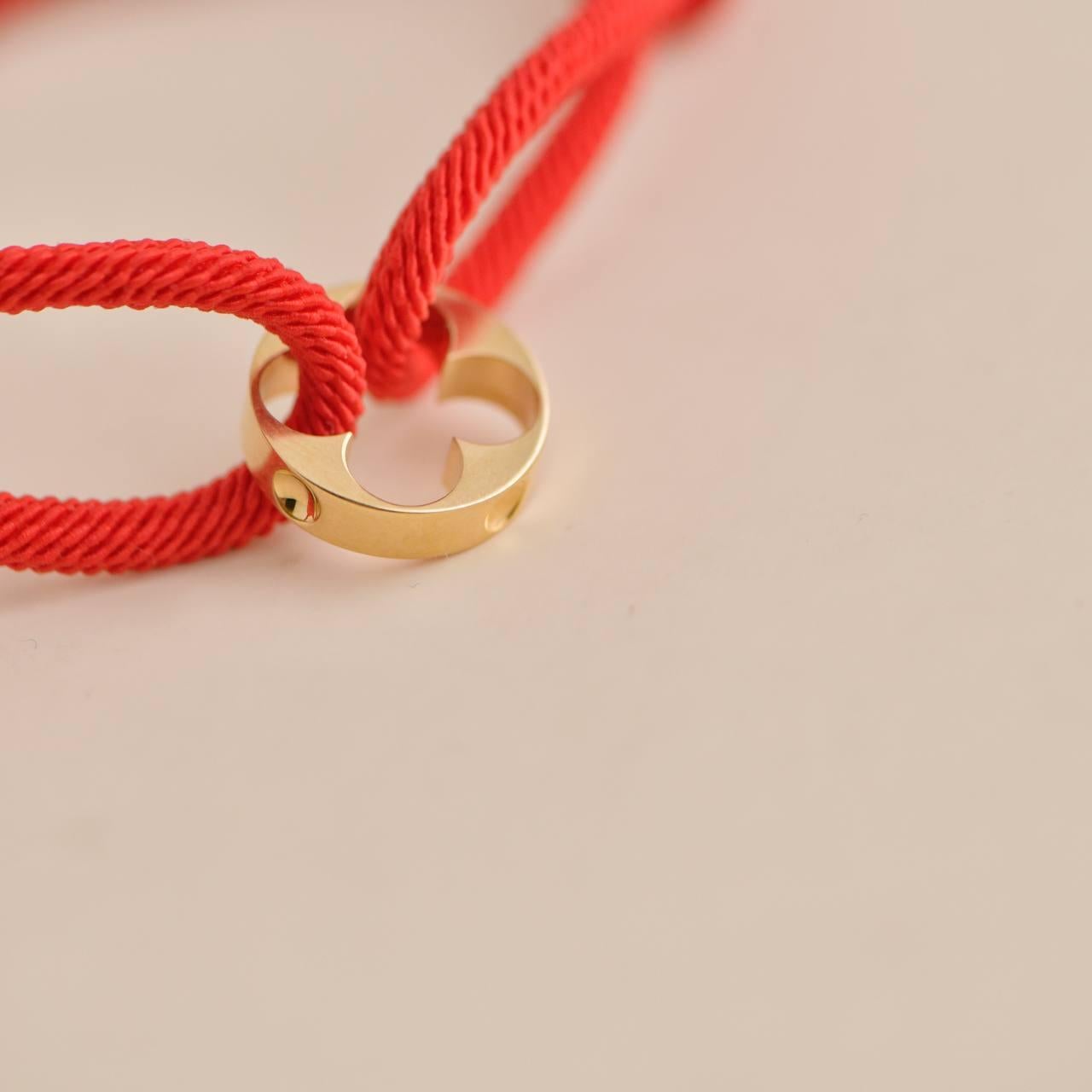 Louis Vuitton Empreinte 18K Gelbgold Rotes Cord-Armband für Damen oder Herren