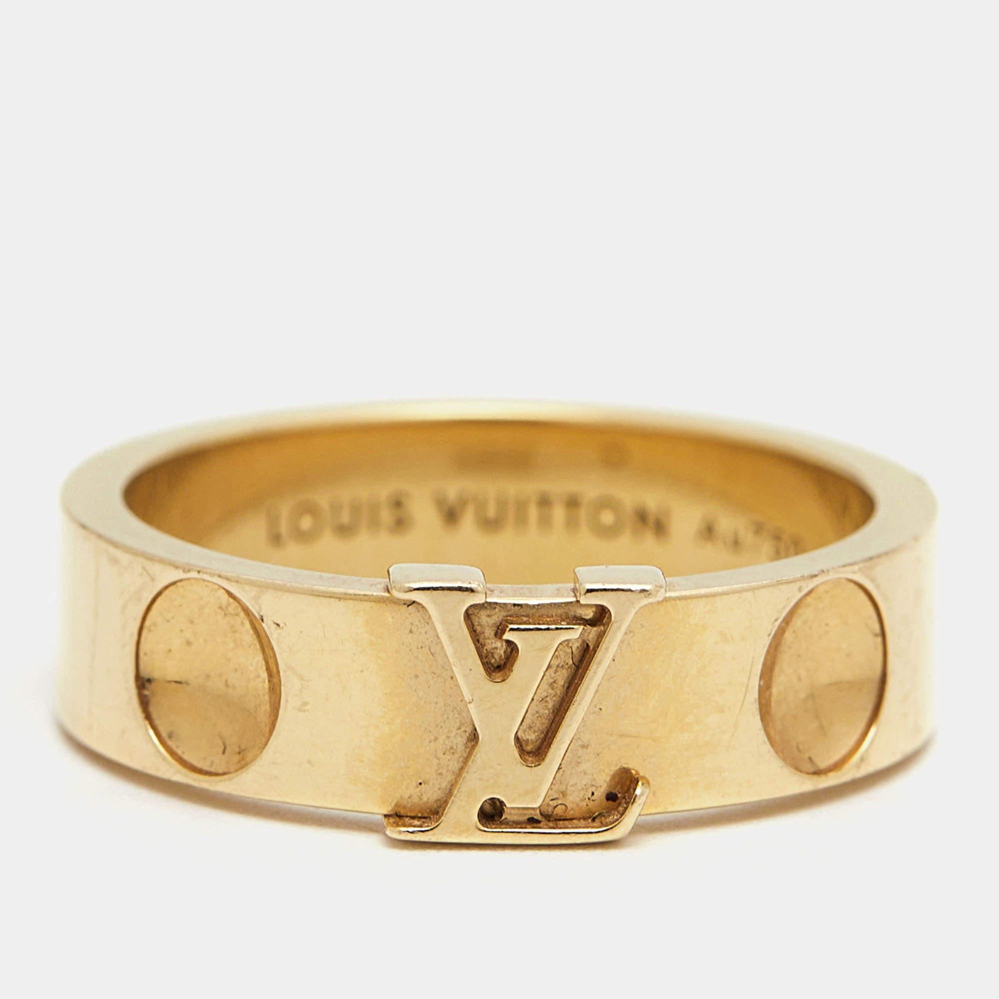 Crafted with precision and opulence, the Louis Vuitton ring exudes timeless elegance. Its delicate curves embrace a brilliant display of 18k yellow gold, adorned with the iconic LV emblem meticulously placed. A symbol of refined luxury, it adds a