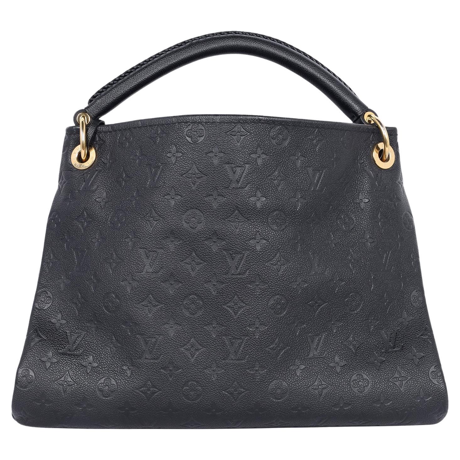 Authentic, pre-loved Louis Vuitton Artsy MM shoulder hobo bag in black empriente leather. The Artsy MM handbag delights with its refined craftsmanship and functional features. Features supple Monogram Empreinte embossed leather, this luxurious hobo