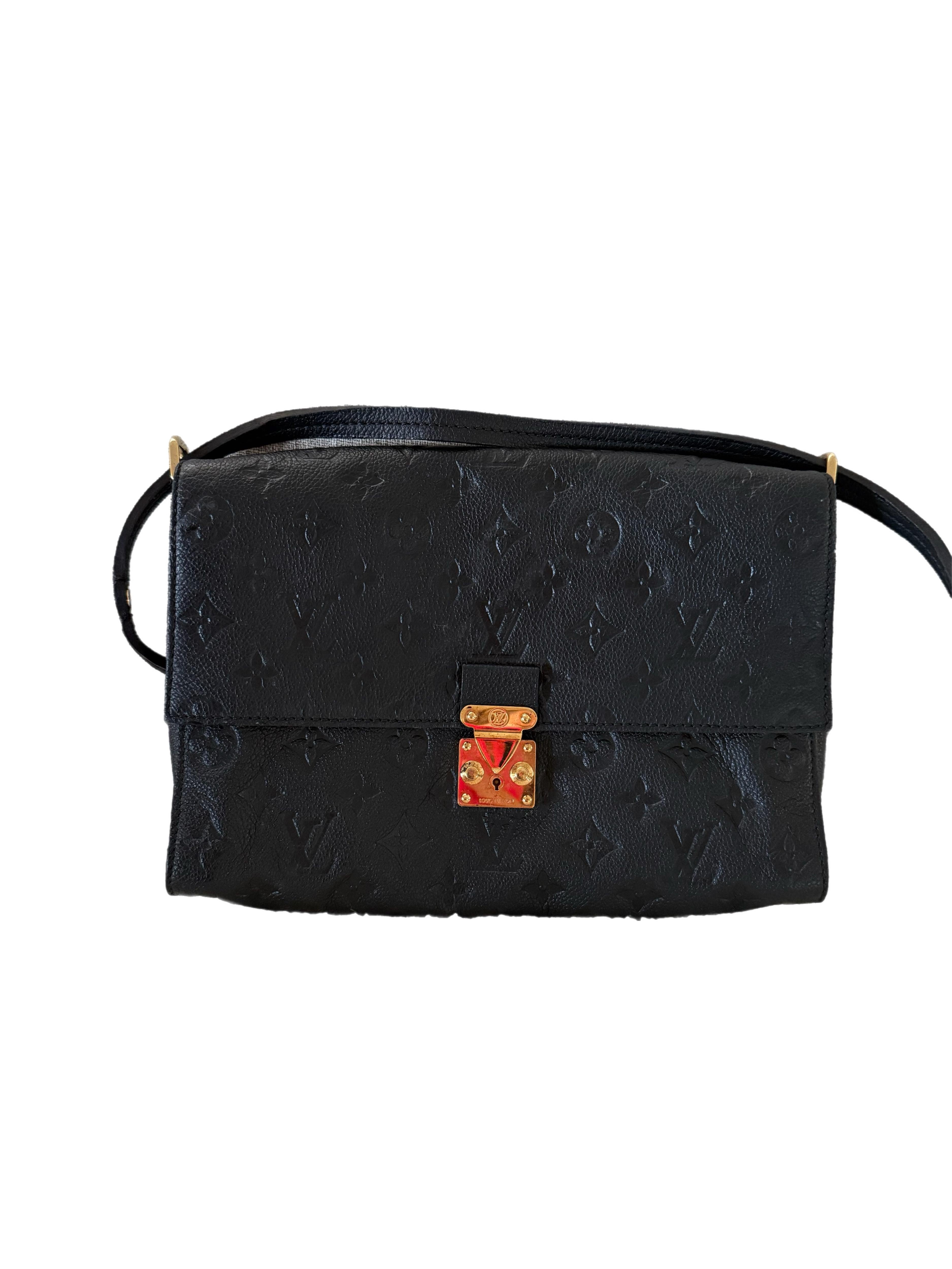 The Louis Vuitton Monogram Empreinte Fascinante Shoulder Bag in Black is a sophisticated and versatile accessory crafted from luxurious Monogram Empreinte leather. Featuring a structured yet elegant silhouette, the bag is designed with a secure