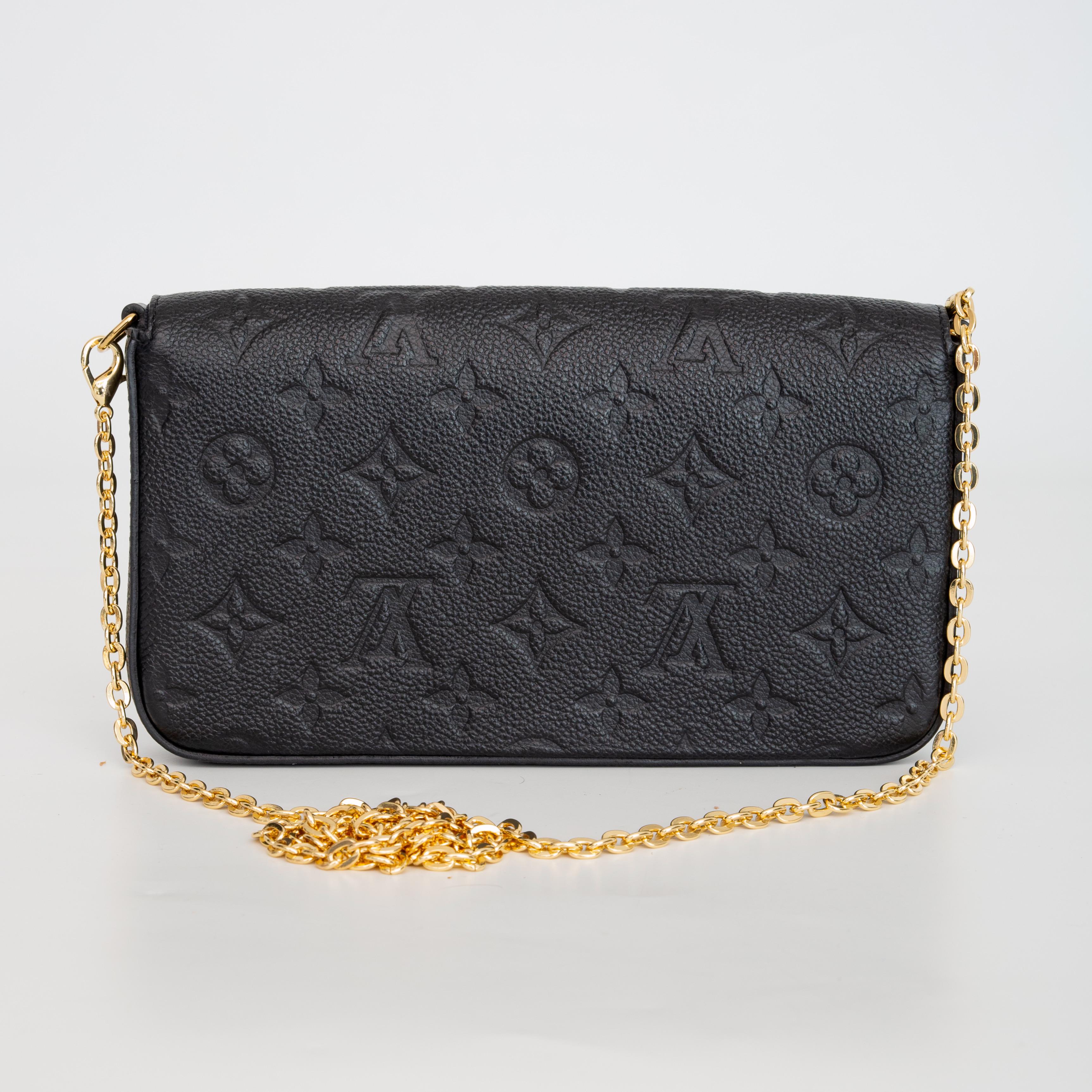 This Pochette Félicie is made from a supple grained cowhide called Empreinte leather with Louis Vuitton's signature monogram pattern embossed. The bag features textile lining, gold tone hardware, press stud closure on front flap and an interior flat