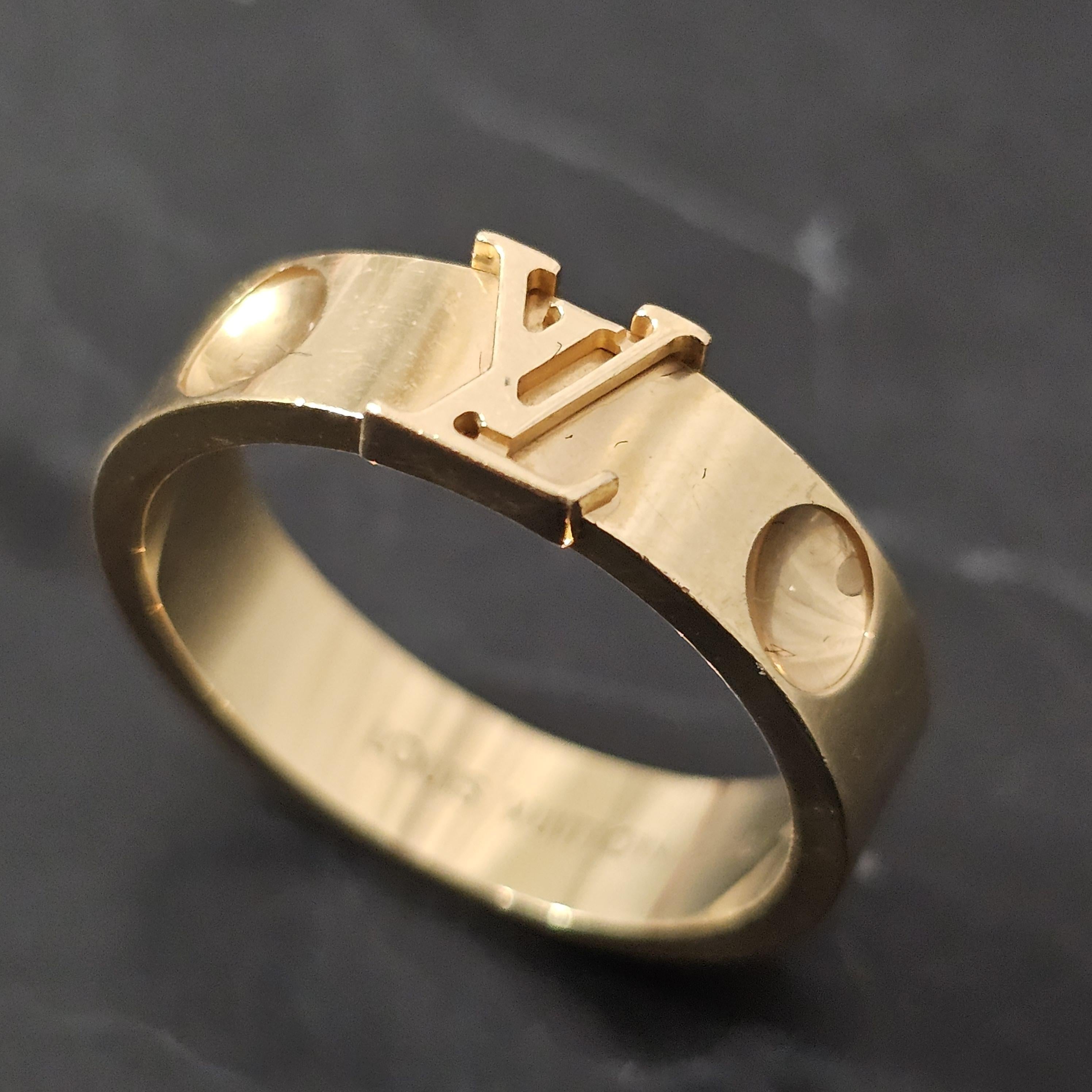 Here we have a Louis Vuitton Empreinte LV band ring in 18k yellow gold, size 8.25.

If you know this brand, you already know this ring likely retailed for several thousand dollars. These iconic pieces rarely come up on the secondary market. Don't