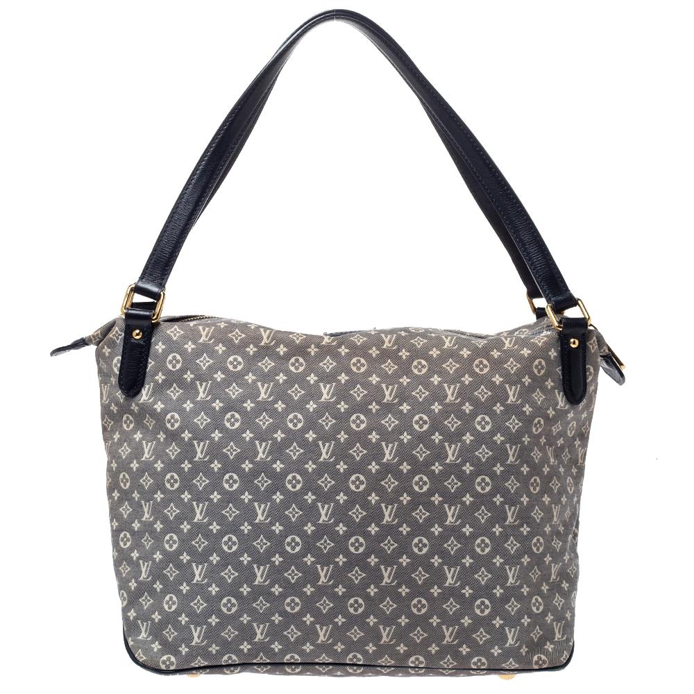 This stylish bag comes from the iconic house of Louis Vuitton. Crafted from Encre Monogram canvas, it has a signature appeal and is perfect for everyday use. It has dual handles, top-zip closure, gold-tone hardware and a spacious fabric-lined