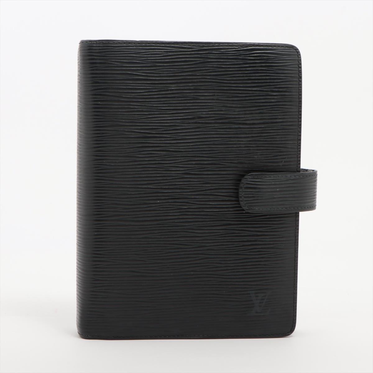 The Louis Vuitton Epi Agenda MM Notebook Cover in black is a luxurious and functional accessory that combines style with practicality. Crafted with Louis Vuitton's iconic Epi leather, the notebook cover exudes sophistication and elegance. The