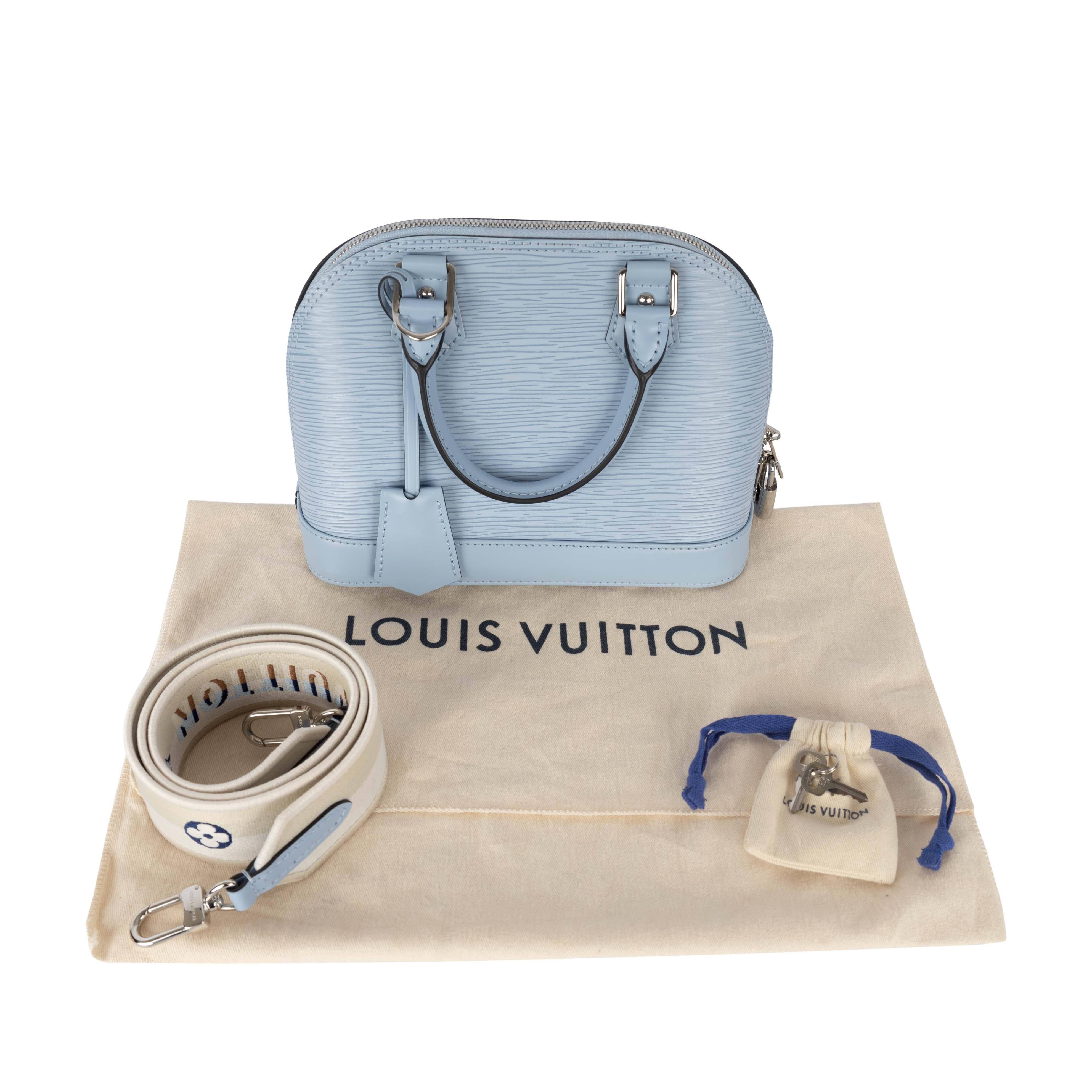Made with the brand's signature epi leather, the Louis Vuitton Epi Alma BB in pastel blue comes with a stylish long removable giving it a distinct vibe and making it easy to carry it around or across the shoulder. The main chain compartment includes