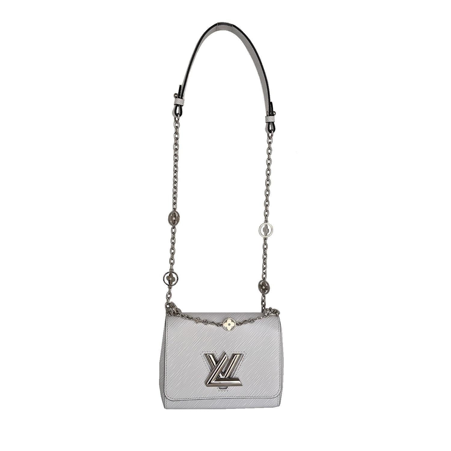 This Louis Vuitton’s iconic Twist belongs to the Twist Flower Jewels special edition. Crafted from White grained Epi leather, it features a sparkling, crystal-embellished chain adorned with Monogram Flowers, which playfully rotate inside their