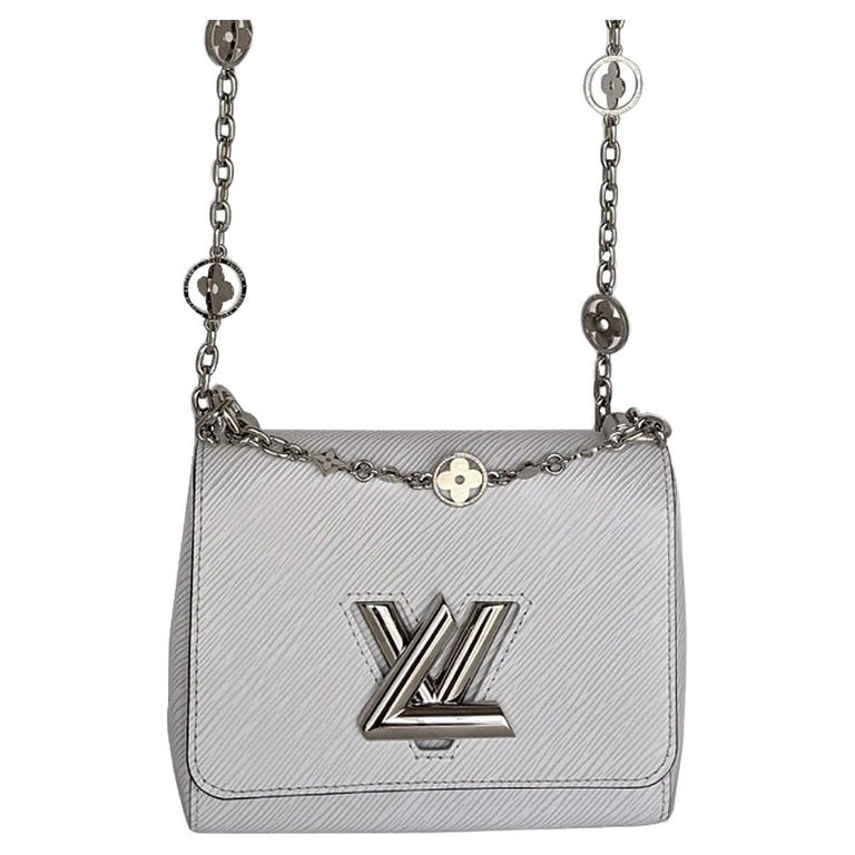 Louis Vuitton White Epi Leather Twist PM Bag at 1stDibs  louis vuitton  twist pm white, louis vuitton twist bag white, louis vuitton twist white