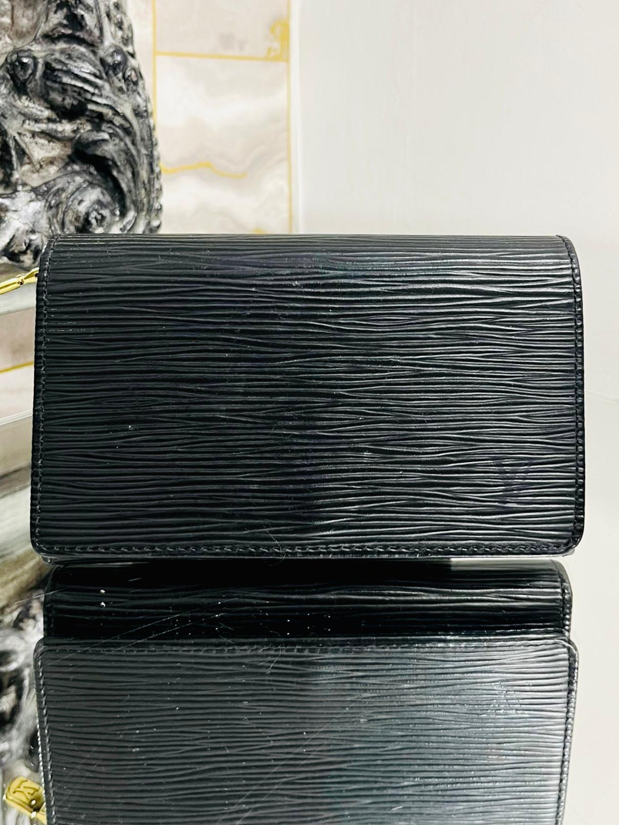 Louis Vuitton Epi Leather Purse/Wallet

Black signature leather purse with flap closure and logo zipper.

'LV' logo embossed to front corner.

Size - Height 9cm, Width 14cm, Depth 2cm

Condition - Vintage - Good (Some gold colour loss to zipper pull